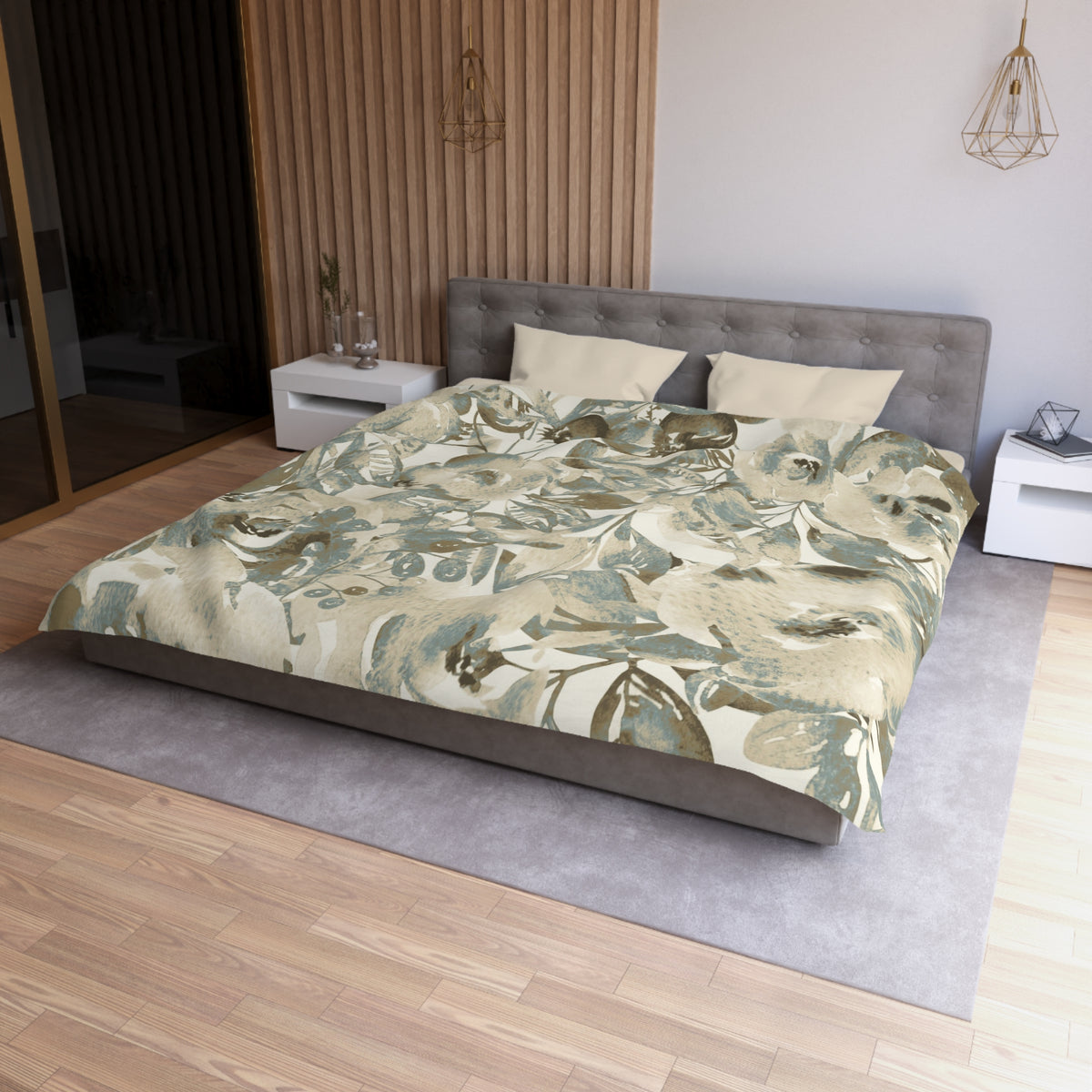 a modern bedroom with a large bed, a gray headboard, and a floral print bedspread. The room has a wooden floor and white nightstands on either side of the bed. There is a pendant light hanging above the bed, and a vase on one of the nightstands. The overall design and decor of the room create a serene and stylish atmosphere.