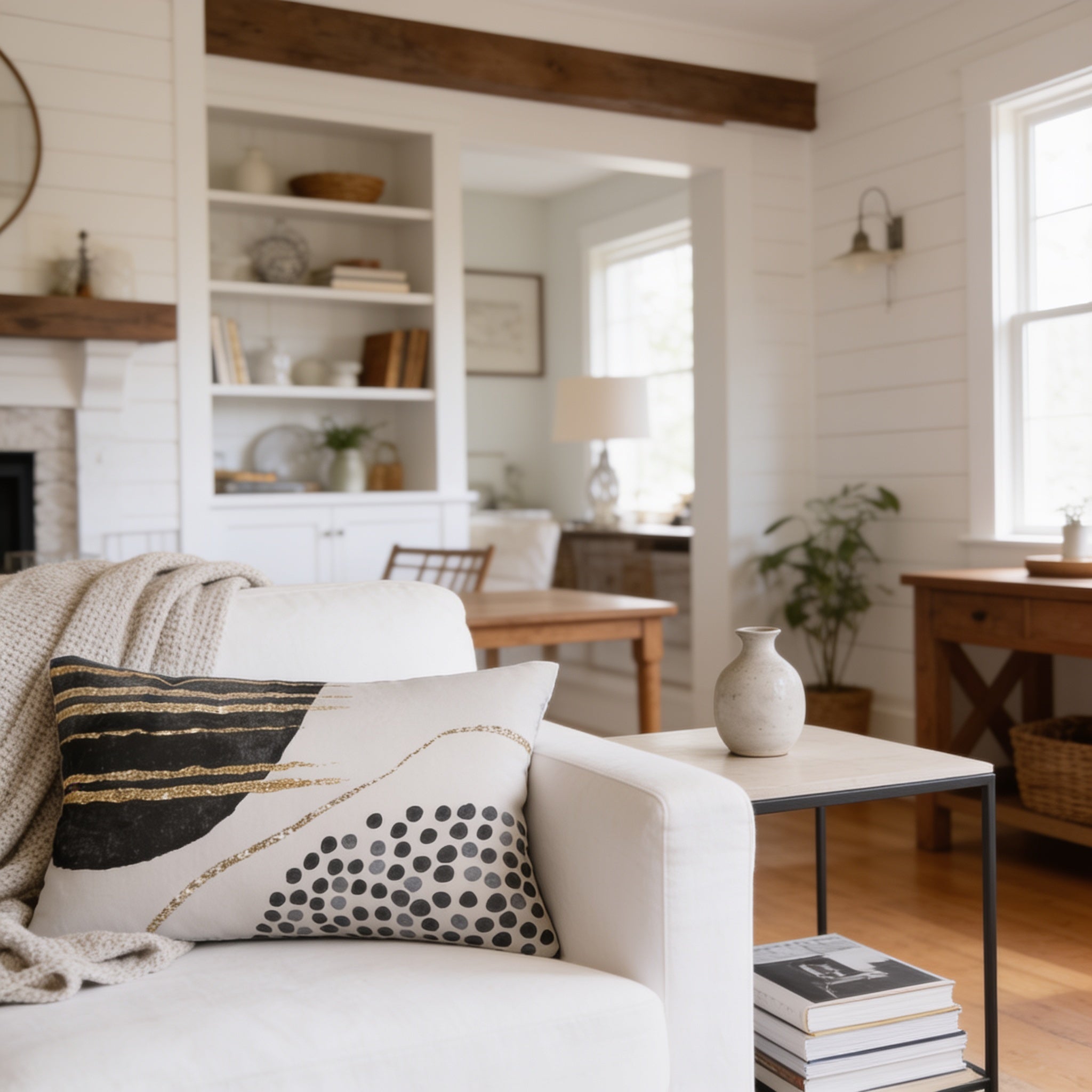 a cozy living room with a white sofa, a wooden coffee table, and a bookshelf filled with various items. The room has a warm and inviting atmosphere, with natural light coming in from the windows.