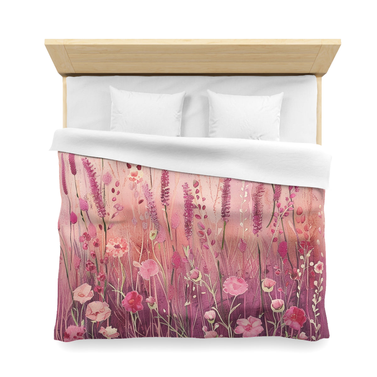 a bed with a floral print duvet cover featuring a field of pink and purple flowers.
