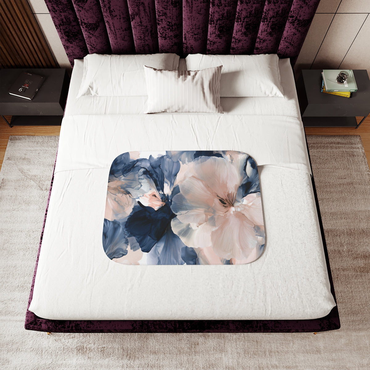 a bed with a purple headboard and white sheets