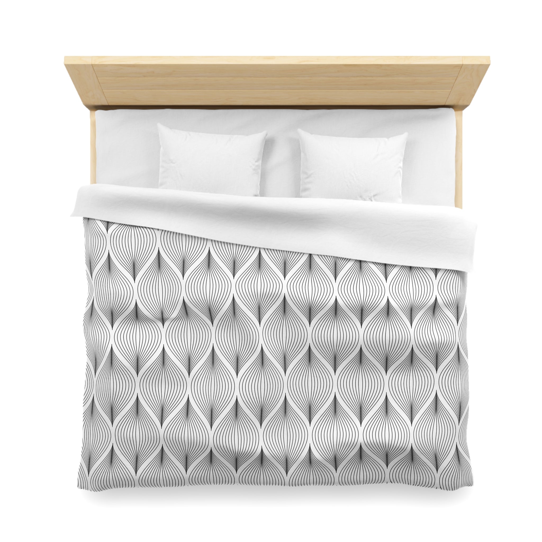 a neatly made bed with a gray and white patterned comforter and two white pillows.
