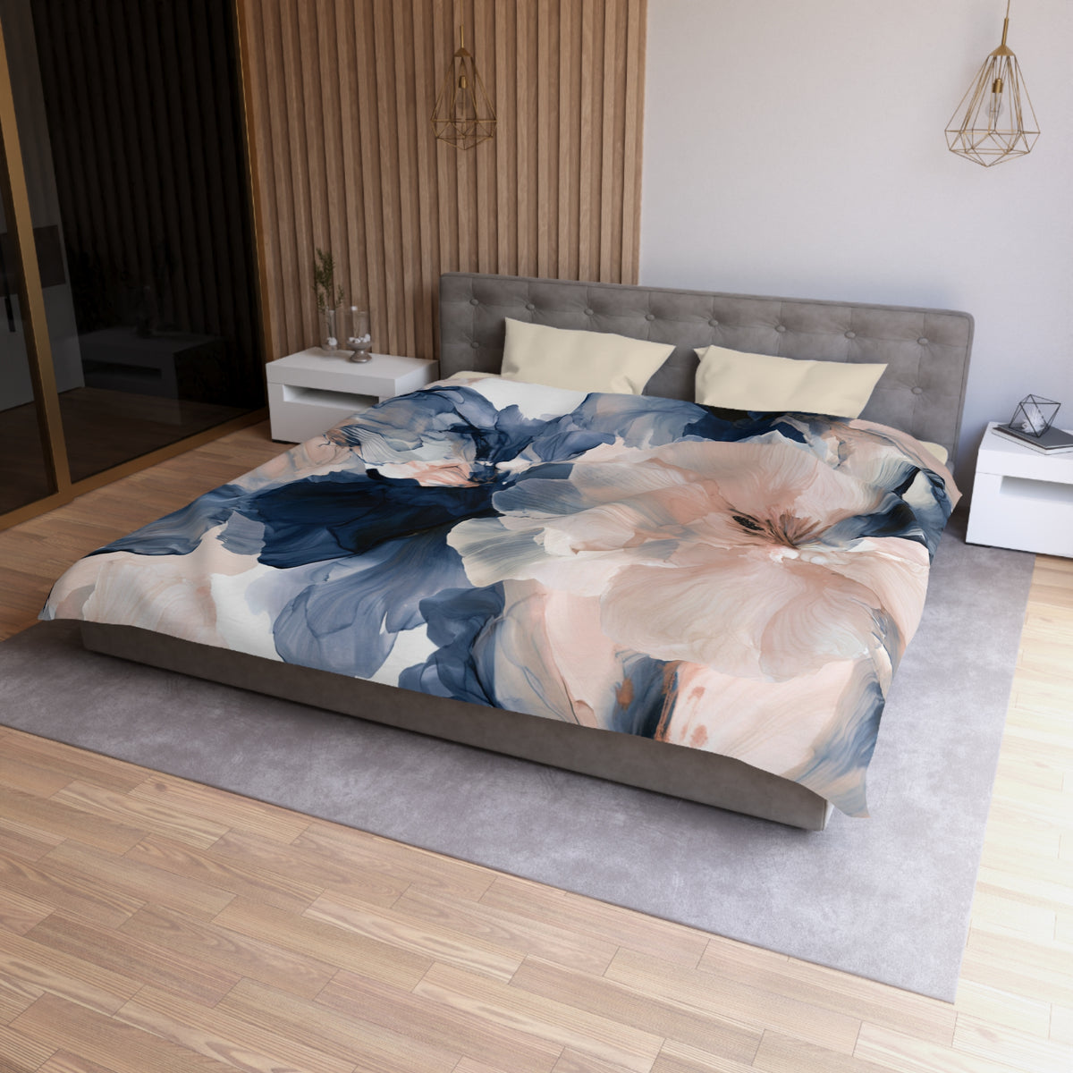 a bed with a floral comforter on top of it