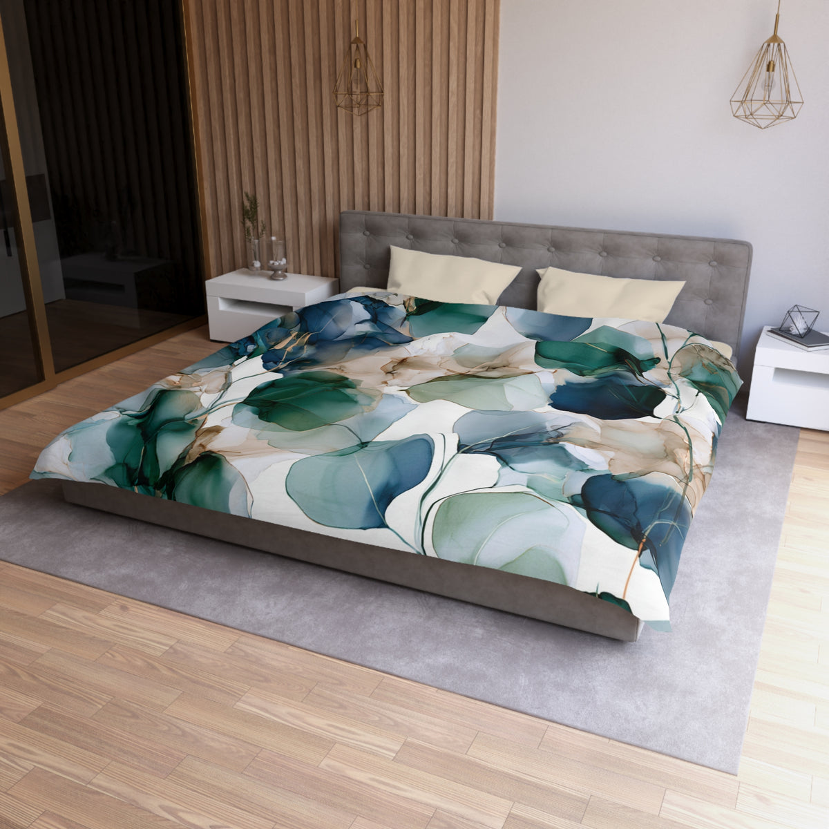 a bed with a floral comforter on top of it