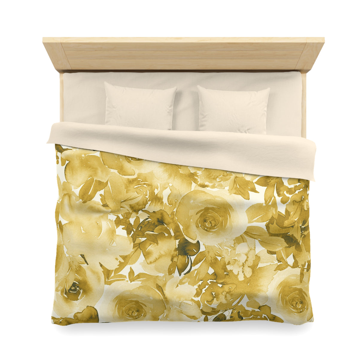a bed with a floral print blanket and pillows.