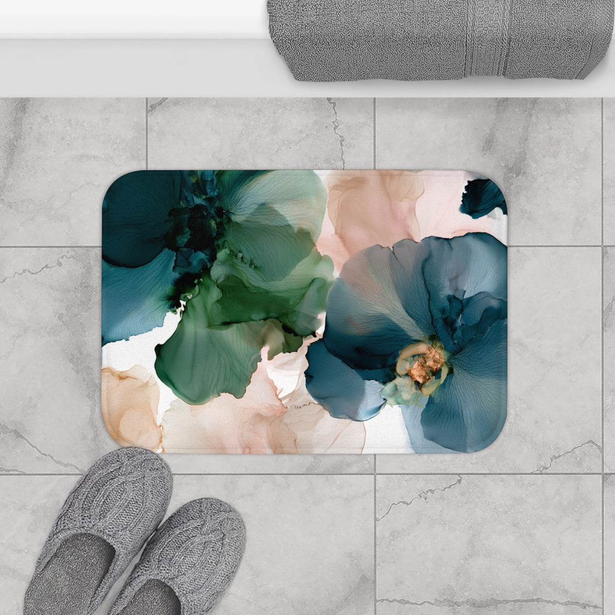 a bathroom rug with a flower design on it