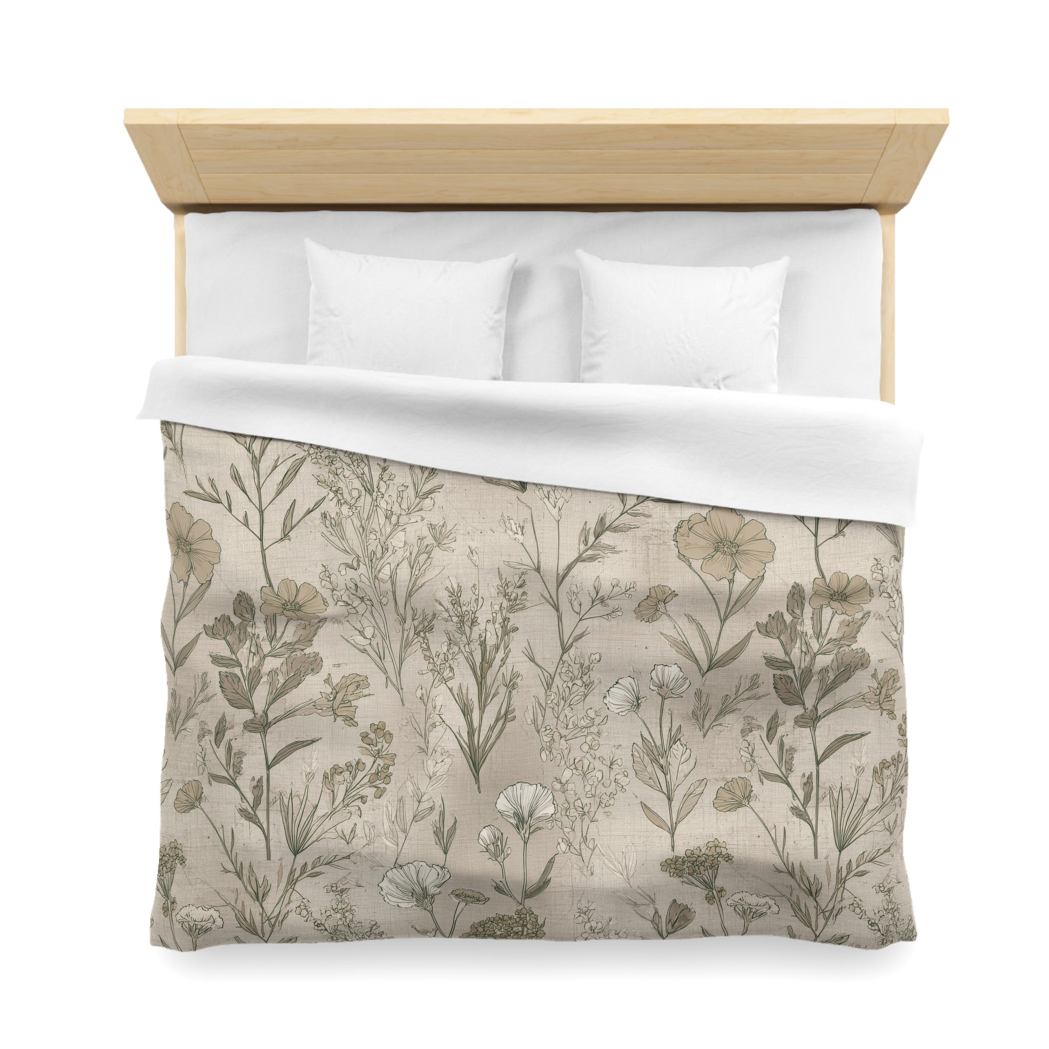 a neatly made bed with a floral print bedspread and two white pillows.