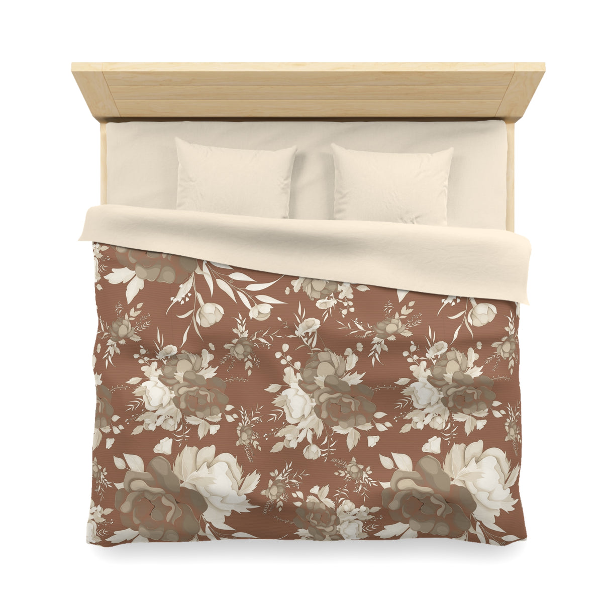 a neatly made bed with a floral patterned comforter and two pillows.