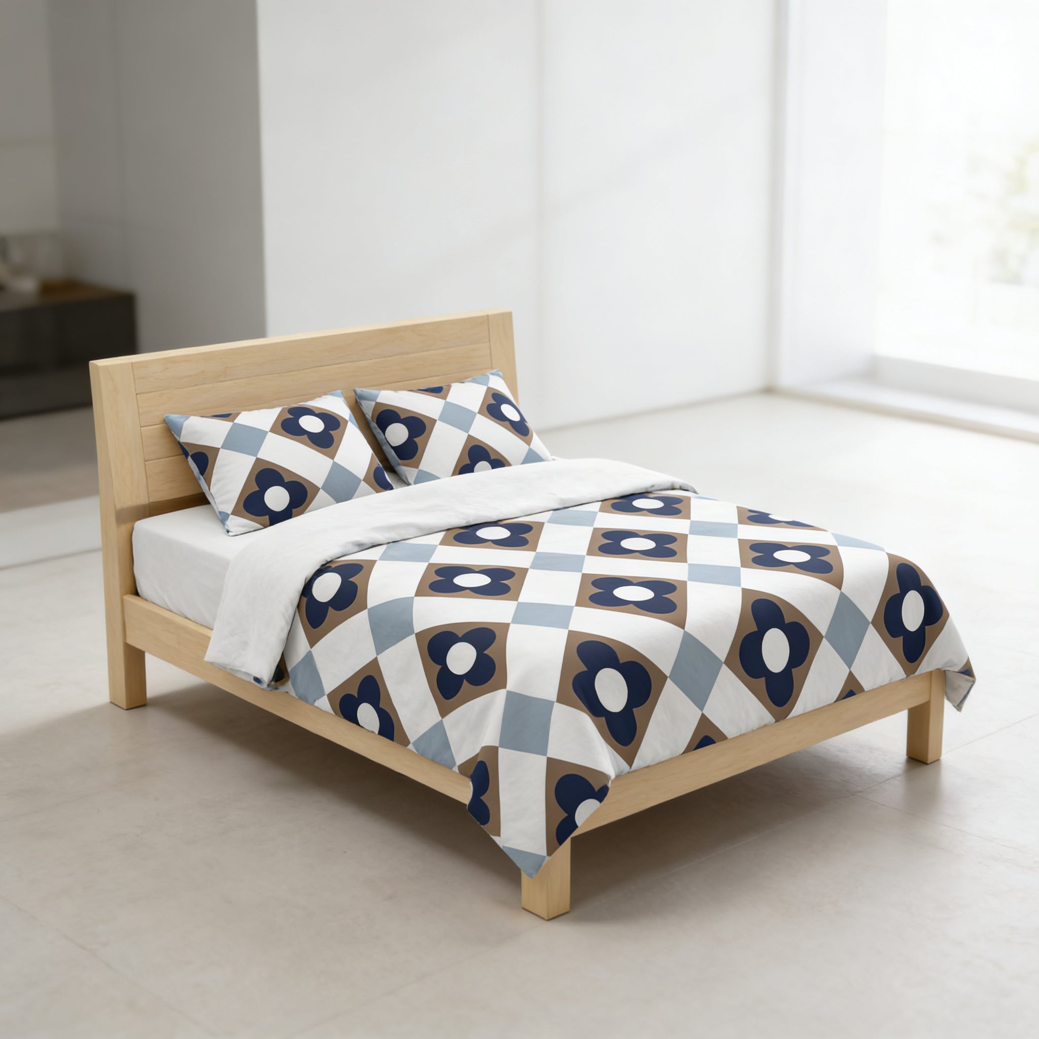 A modern bedroom with a wooden bed frame and a patterned comforter featuring blue and white geometric designs.