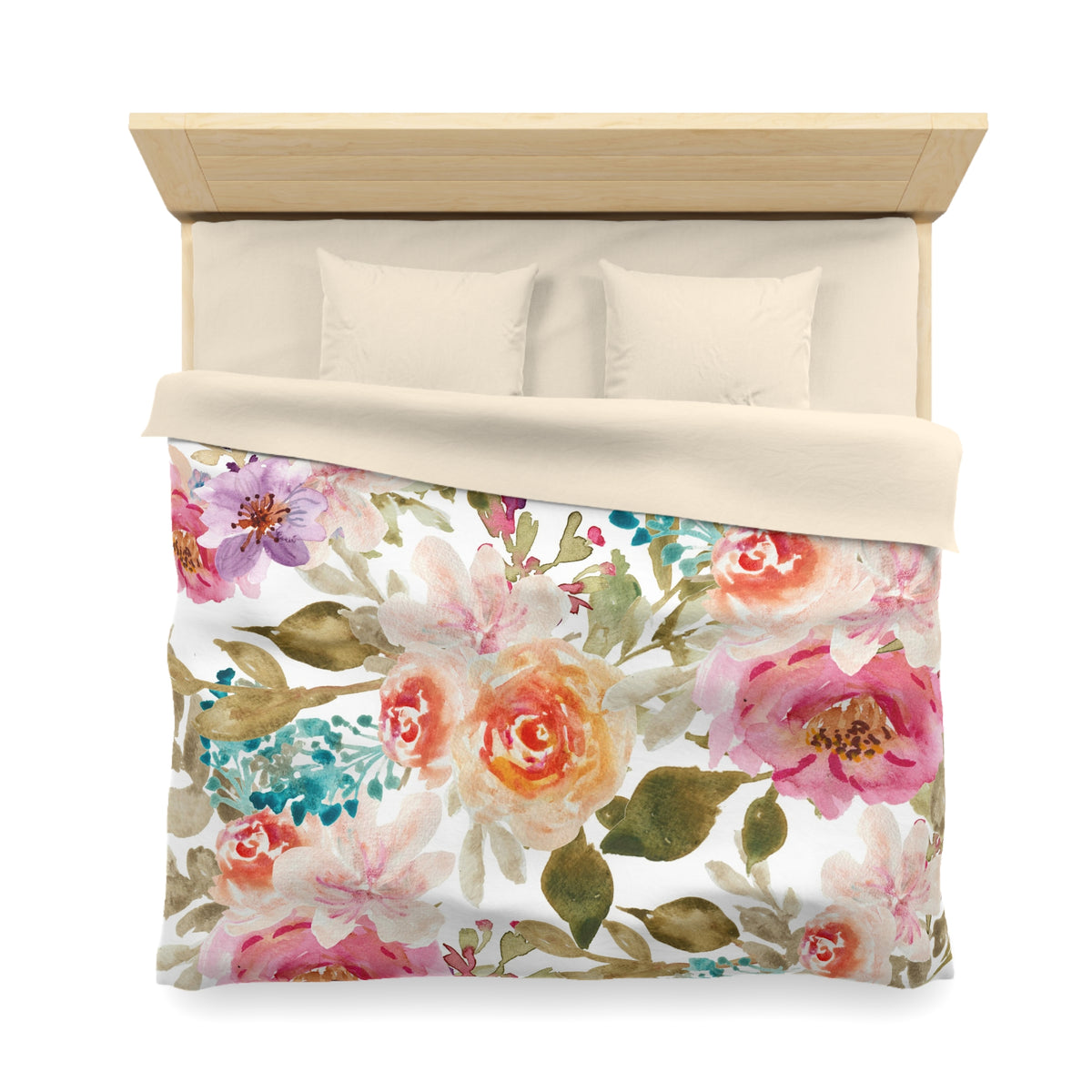 a bed with a floral print duvet cover and pillows.