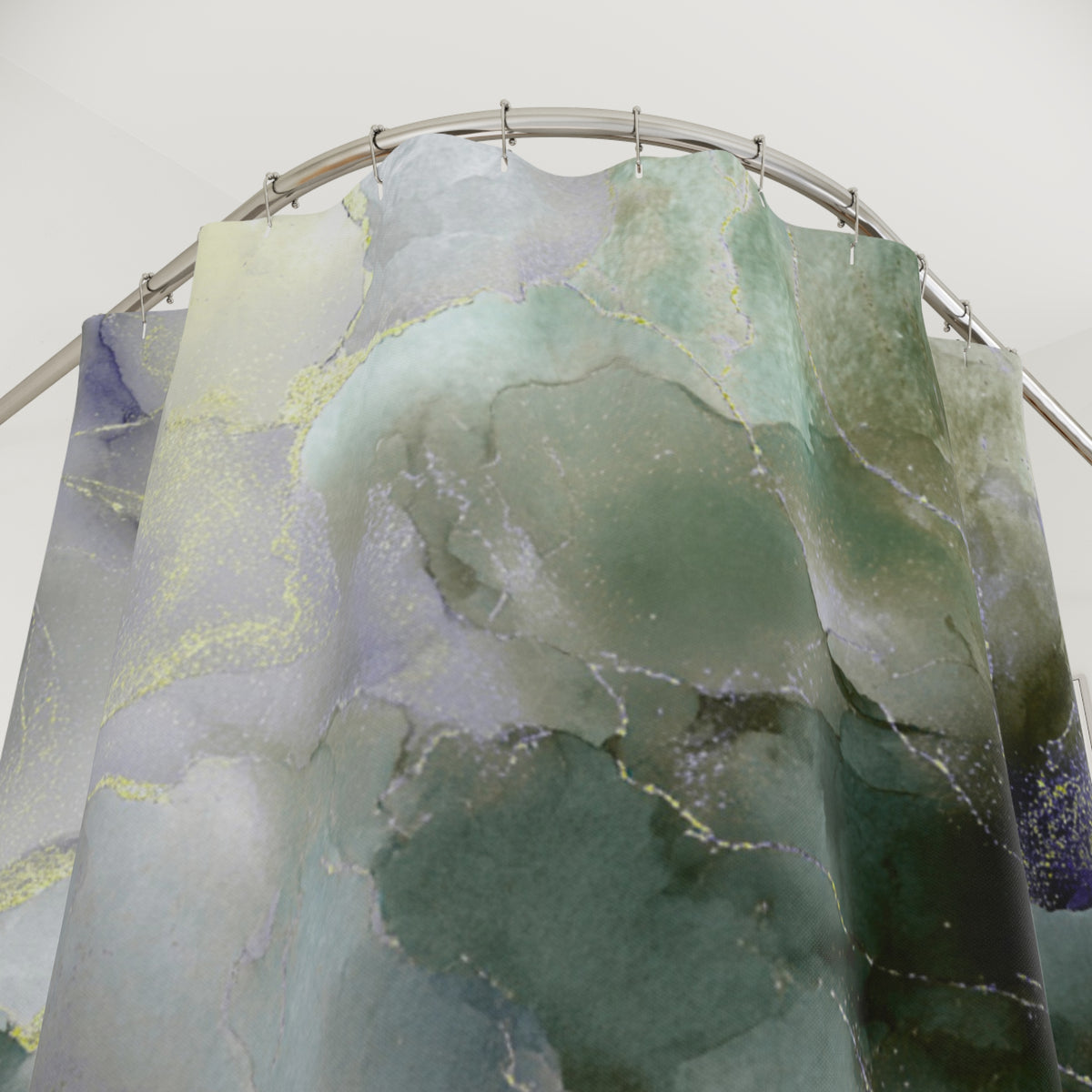 a shower curtain with a marble-like pattern in shades of green and gray.
