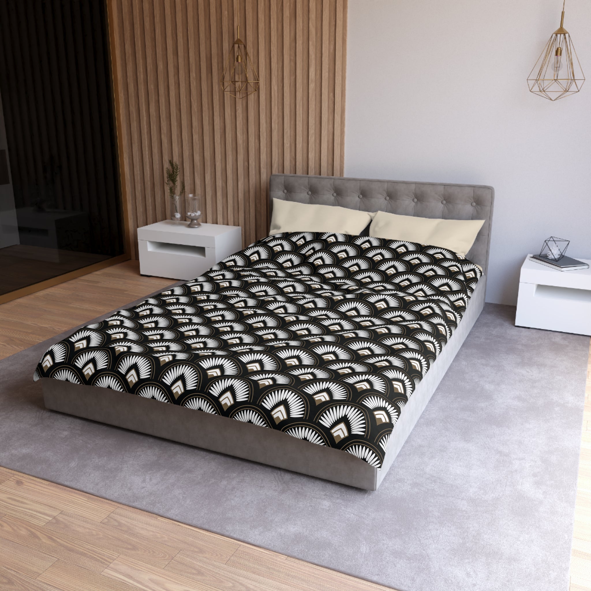 a modern bedroom with a gray tufted headboard, a black and white patterned comforter, and a white nightstand on the left side of the bed.