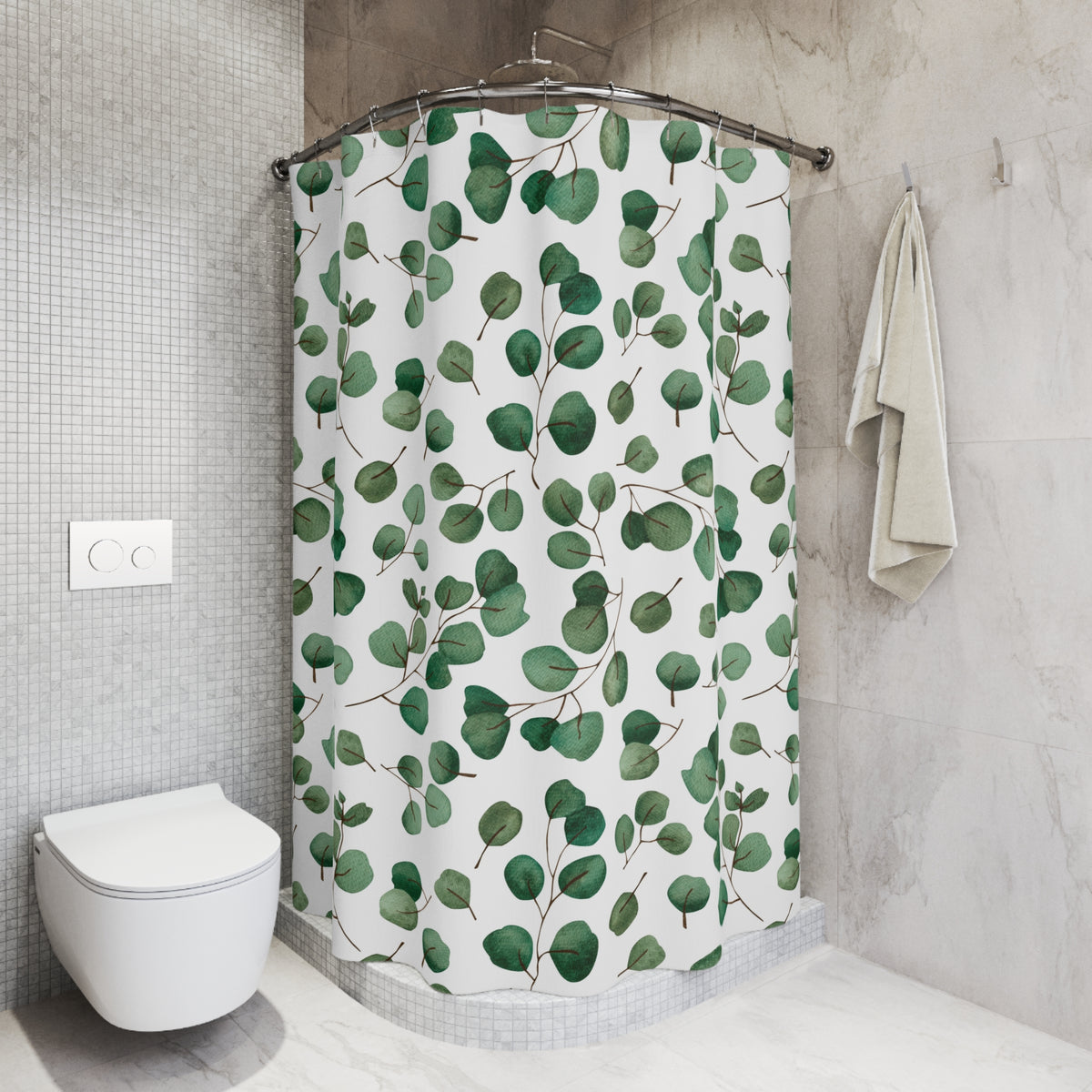 a bathroom with a shower curtain adorned with a pattern of green leaves. The shower curtain is hanging on a rod next to a towel, and there is a toilet visible in the corner of the room.