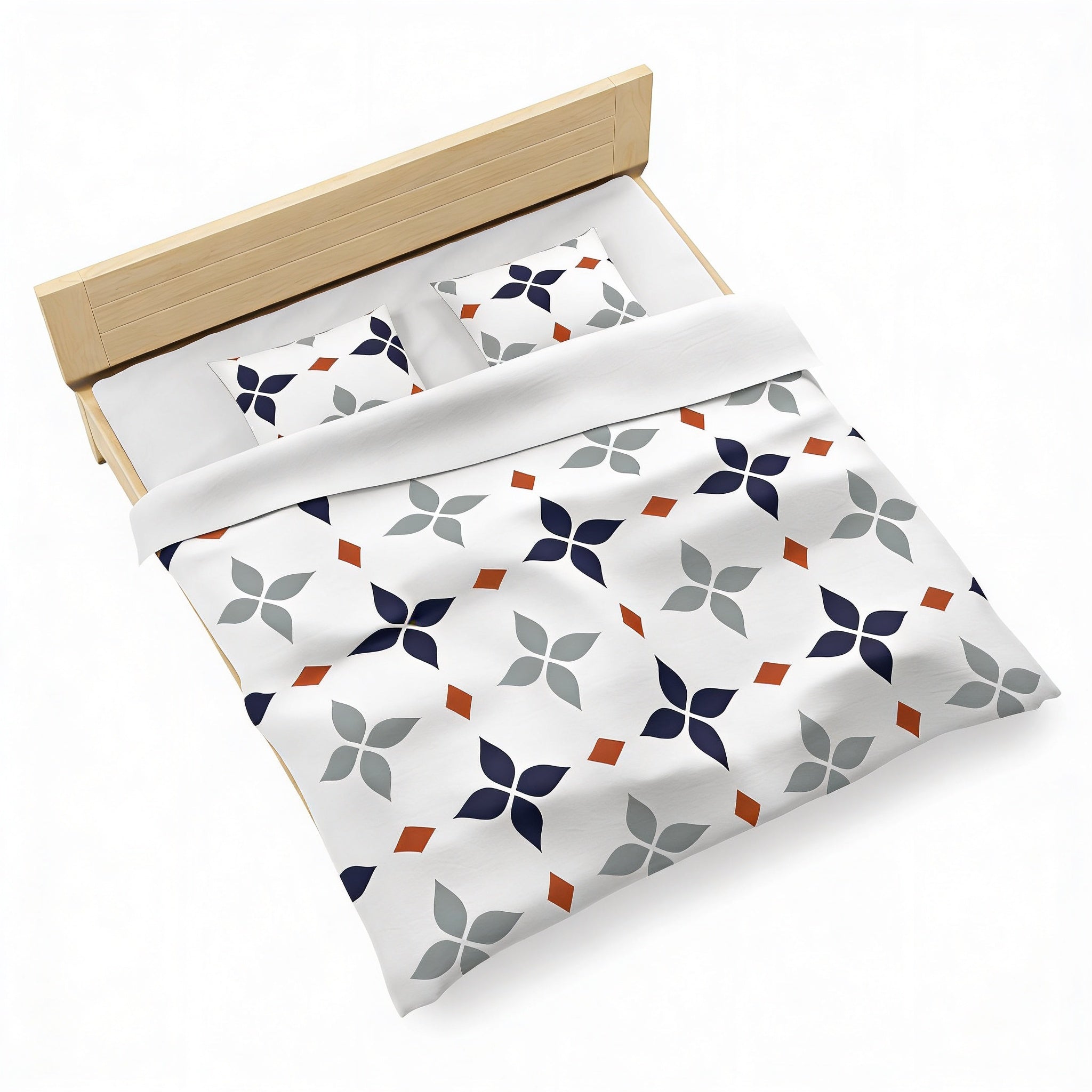 a neatly made bed with a white comforter and a patterned duvet cover featuring a repeating design of blue and orange flowers.