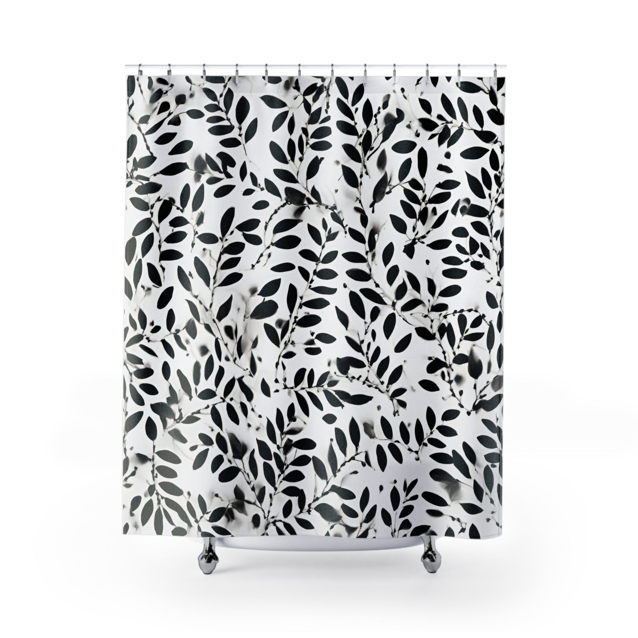 a black and white shower curtain with leaves on it