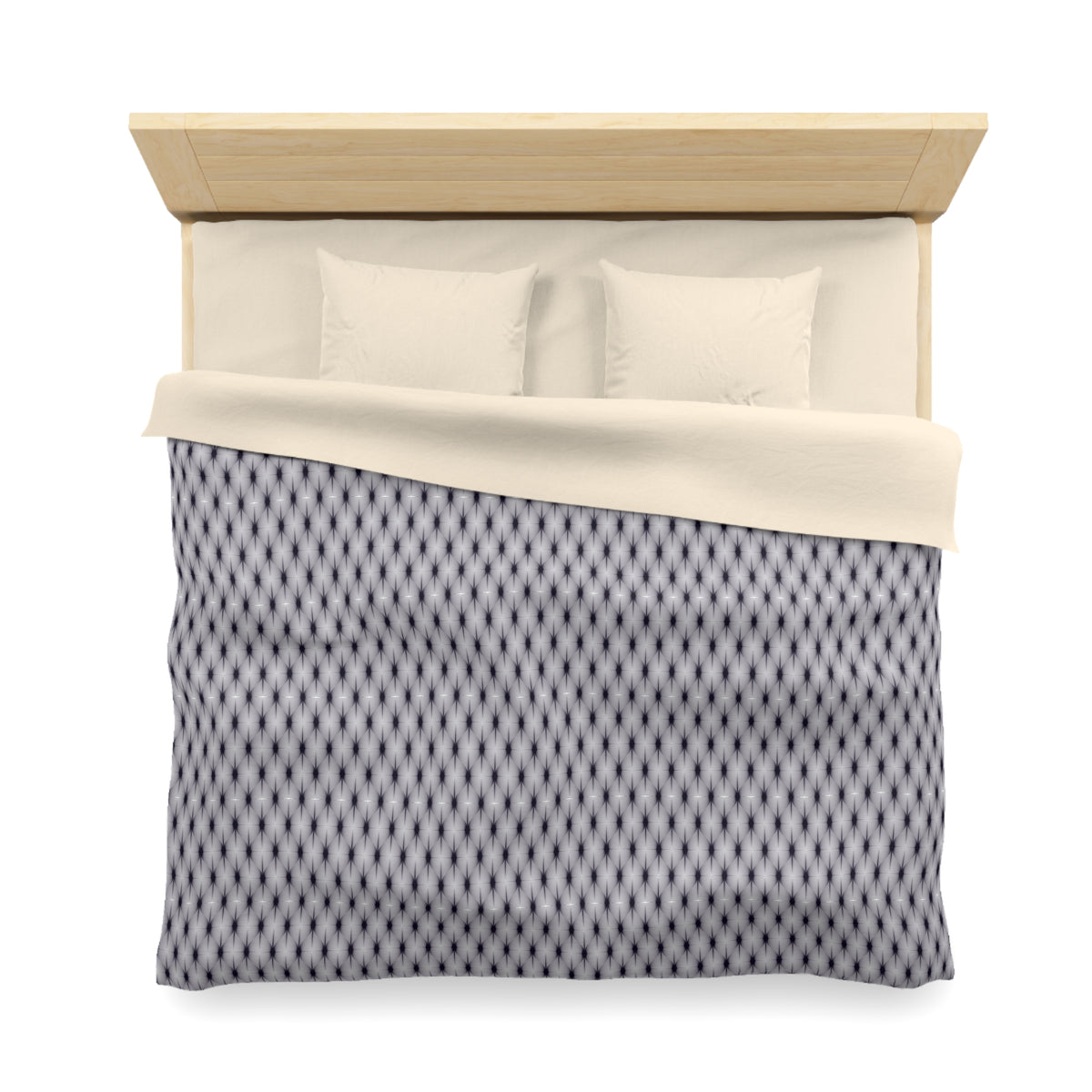A neatly made bed with a patterned comforter and two pillows.