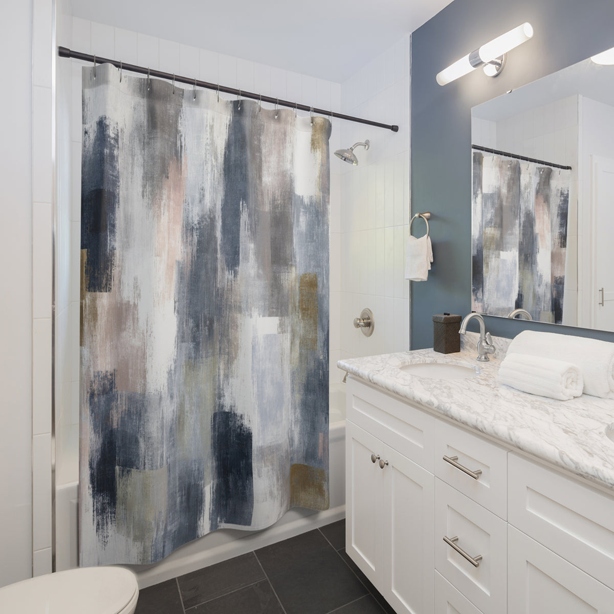 a modern bathroom with a white vanity, a shower curtain with a colorful abstract design, and a mirror above the vanity.