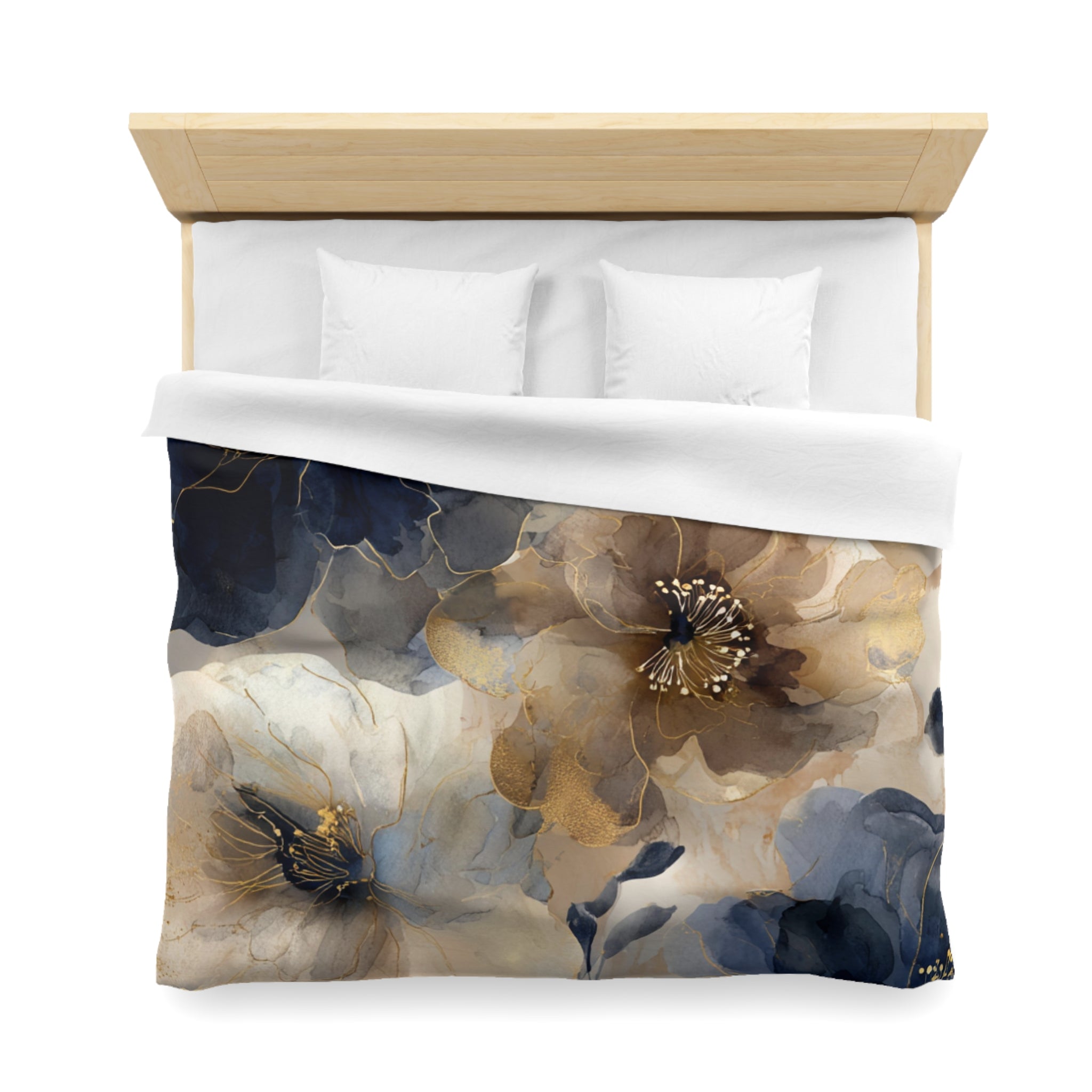 a bed with a floral print duvet cover featuring a combination of blue, gold, and white colors.