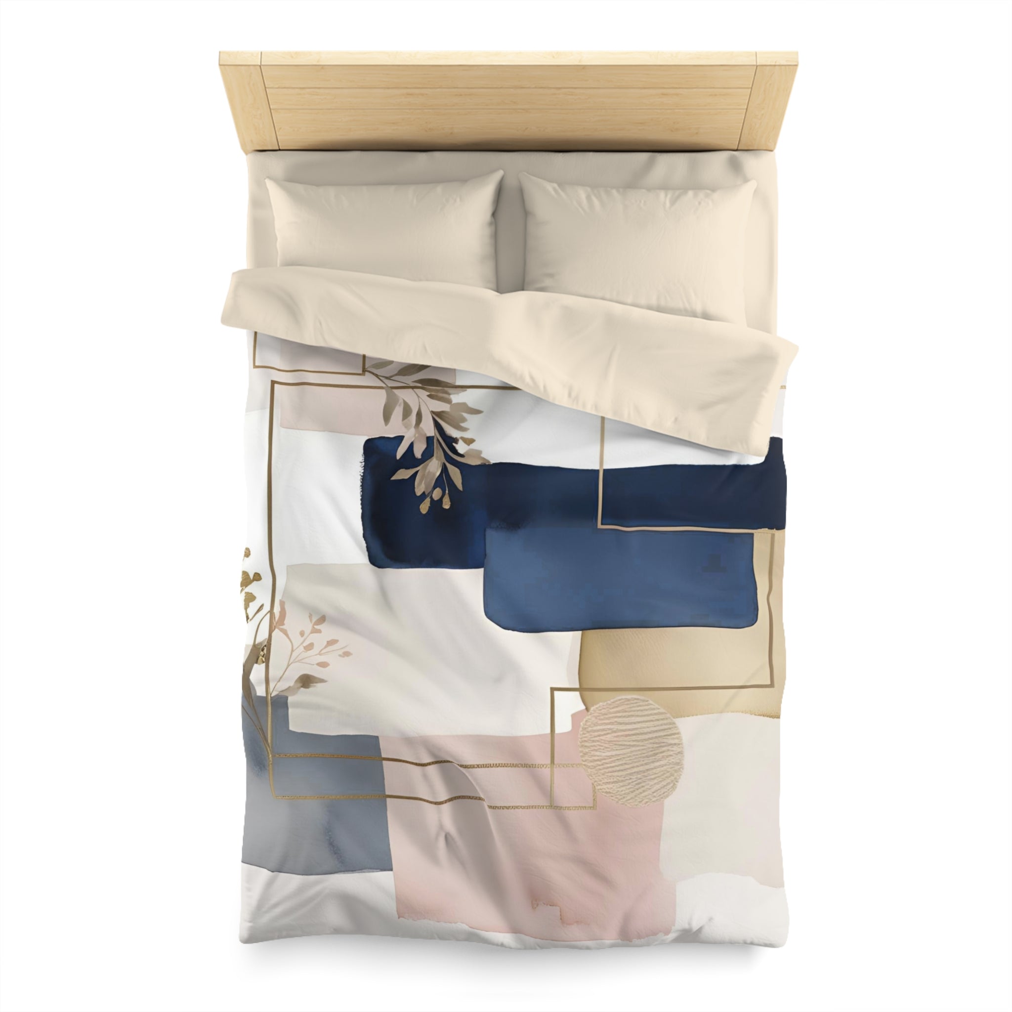 a bed with a white and blue abstract patterned comforter and pillows.