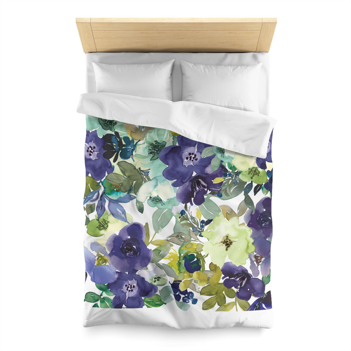 a bed with a floral print duvet cover featuring a variety of colorful flowers and leaves.