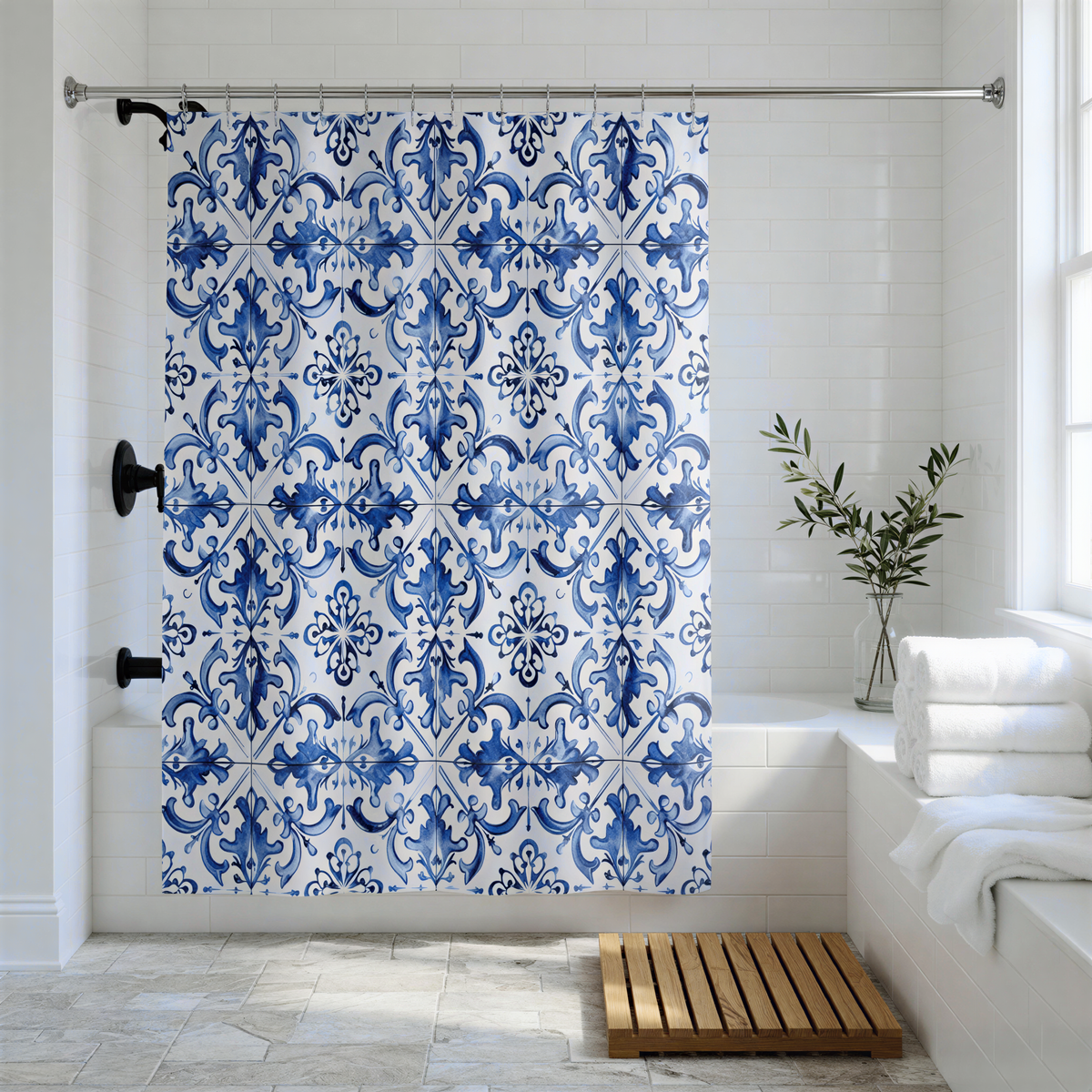 a bathroom with a blue and white patterned shower curtain, a wooden bath mat, and a vase of greenery on the windowsill.