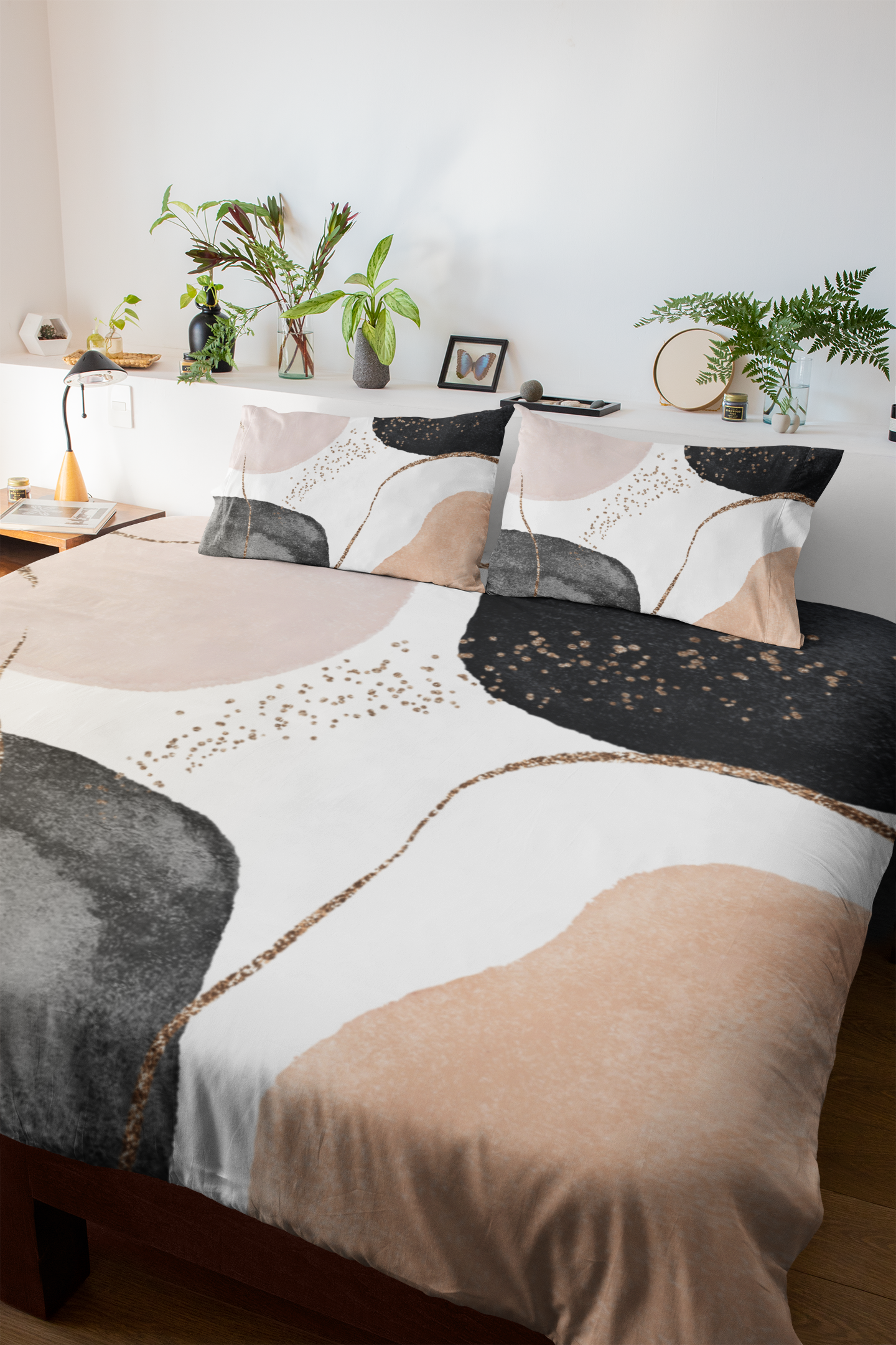 a bed with a black and white comforter and a brown and white comforter