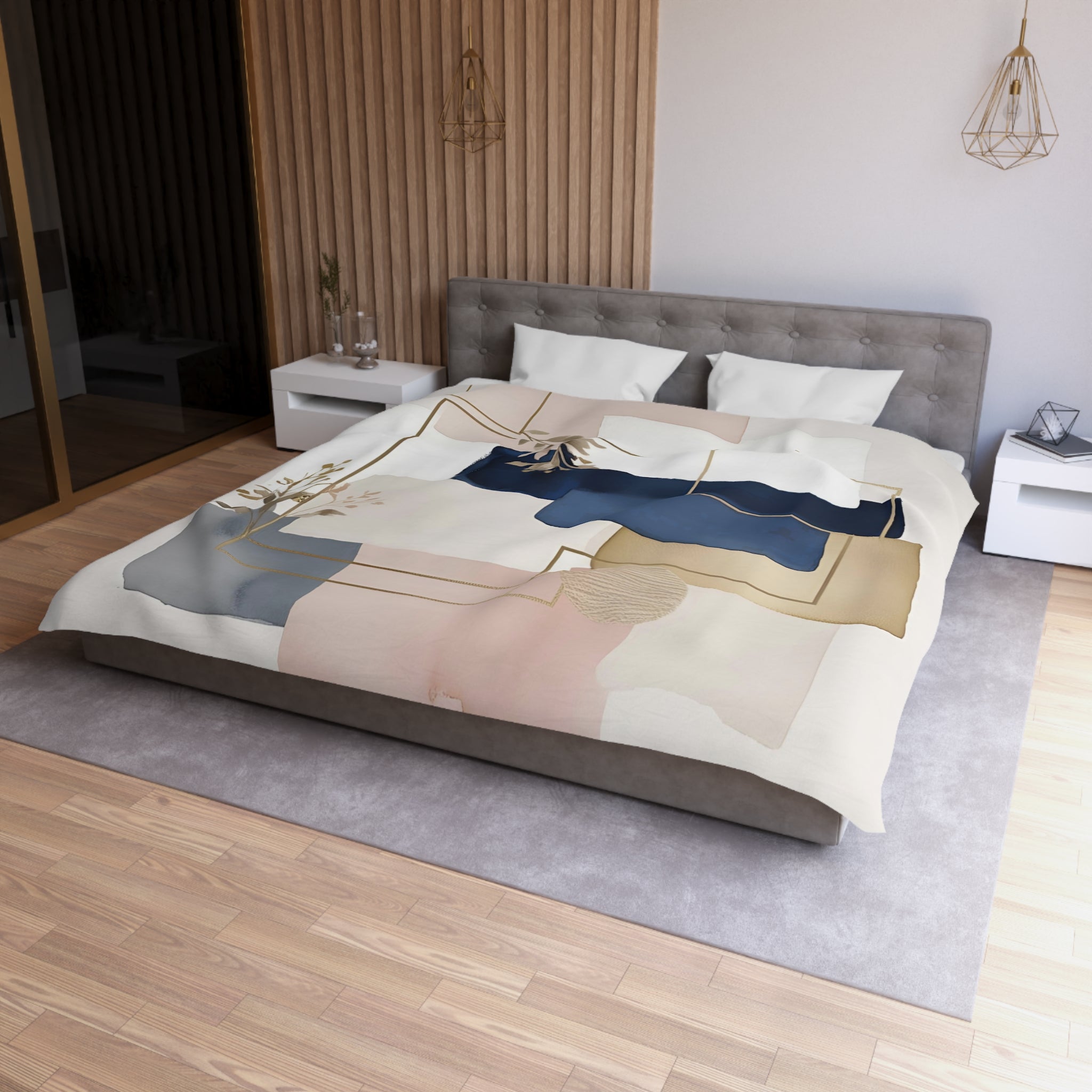a modern bedroom with a large bed, a gray headboard, and a wooden wall. The bed is covered with a colorful abstract comforter featuring a mix of pink, blue, and white geometric shapes. The room has a minimalist and contemporary design, with a gray rug on the floor and a white nightstand on the left side of the bed.