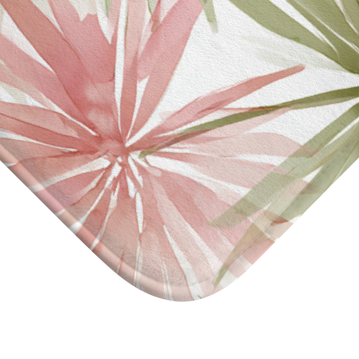 a close-up view of a pink and green floral pattern on a surface, with the focus on the intricate details of the flowers.