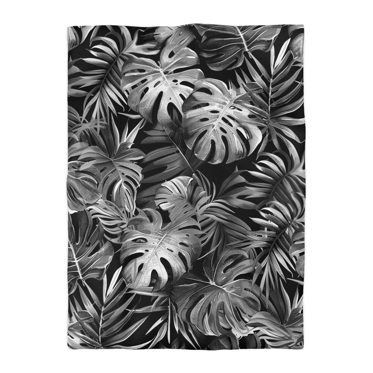 The image is a black and white photograph featuring a dense arrangement of tropical leaves and foliage, creating a striking and visually captivating pattern.