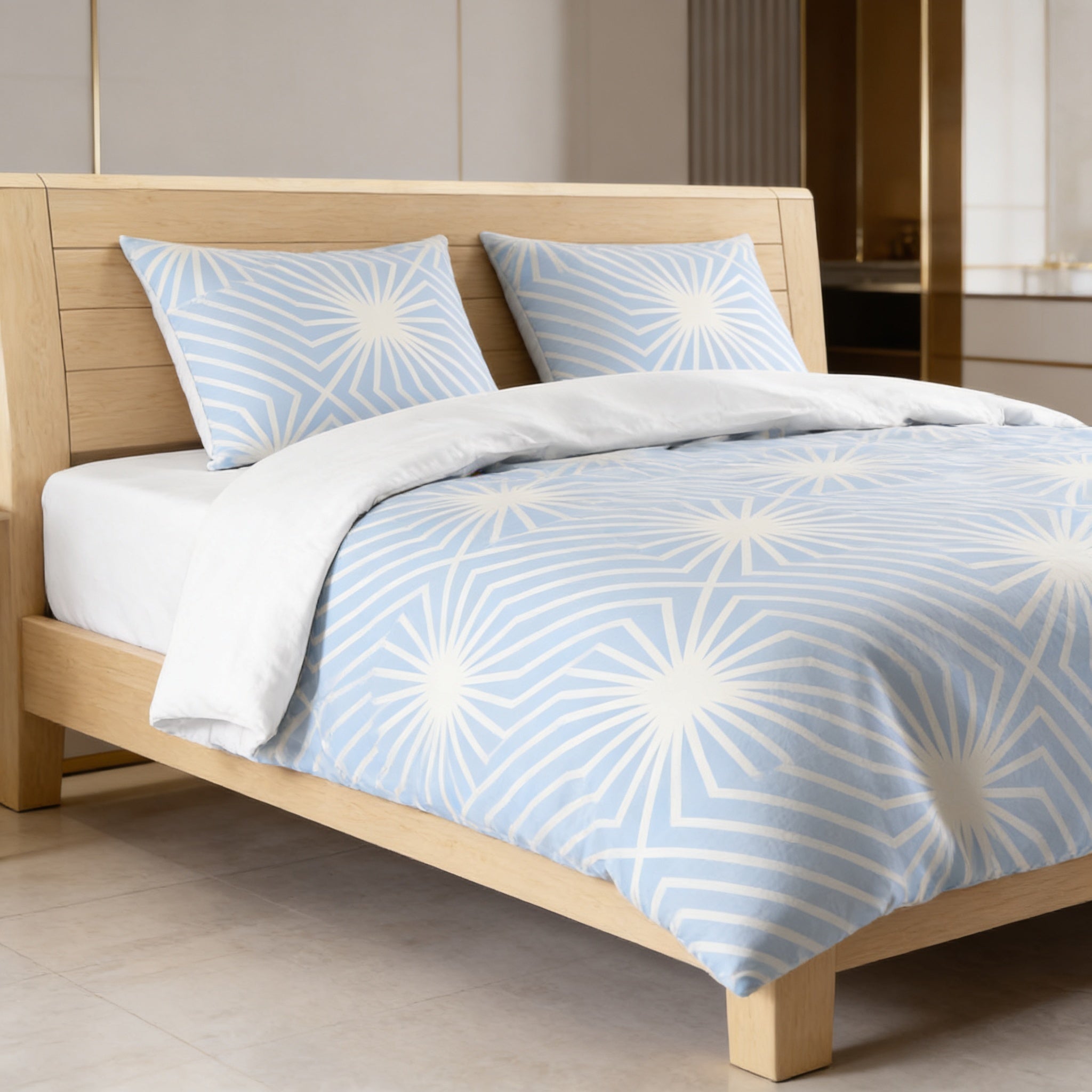 a modern bedroom with a wooden bed frame and a blue and white patterned comforter.