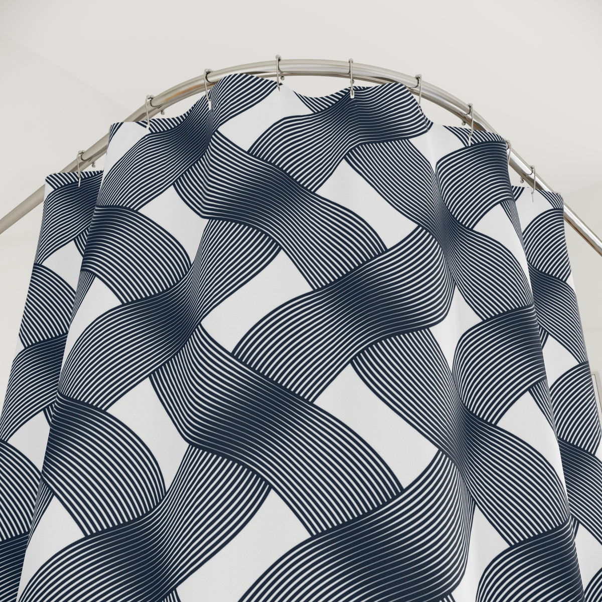 a shower curtain with a repeating pattern of black and white stripes.
