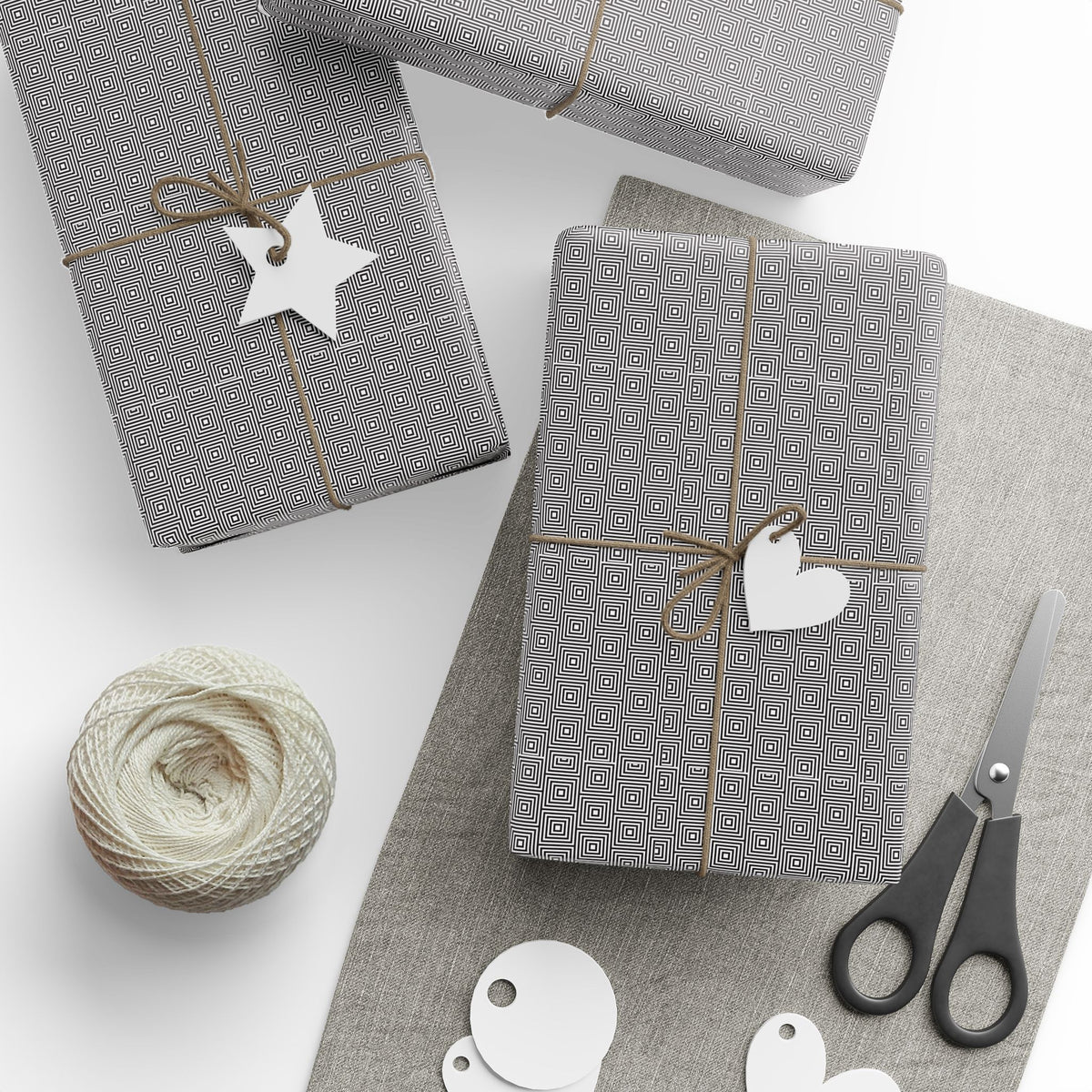 various items related to gift wrapping and crafting, including wrapped presents, scissors, a spool of thread, and some paper tags.