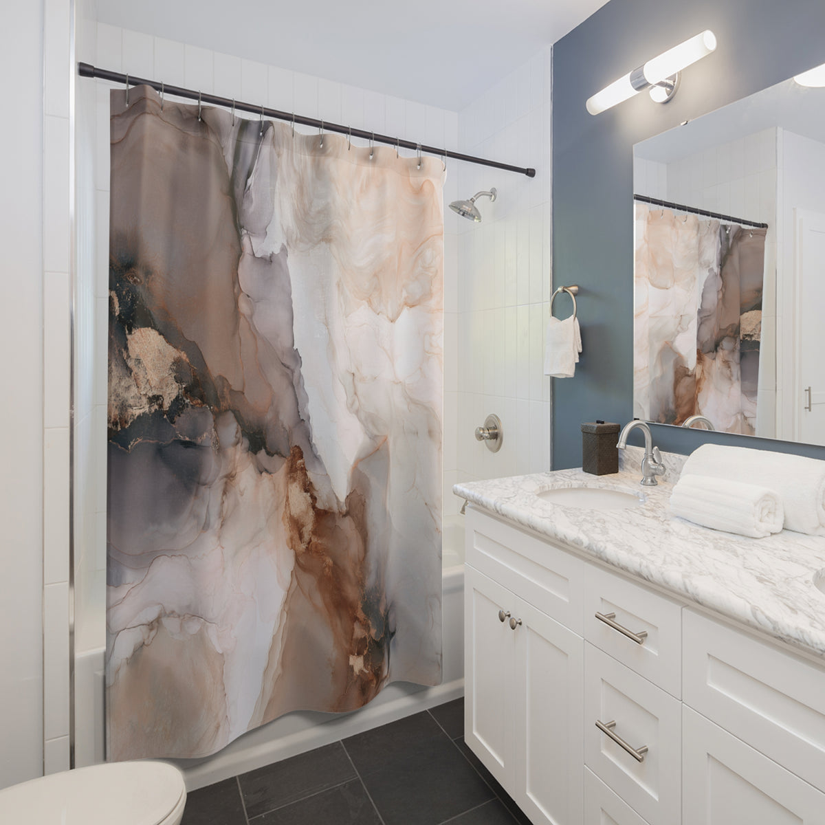 a modern bathroom with a white vanity, marble countertop, and a shower curtain with a marble-like pattern.