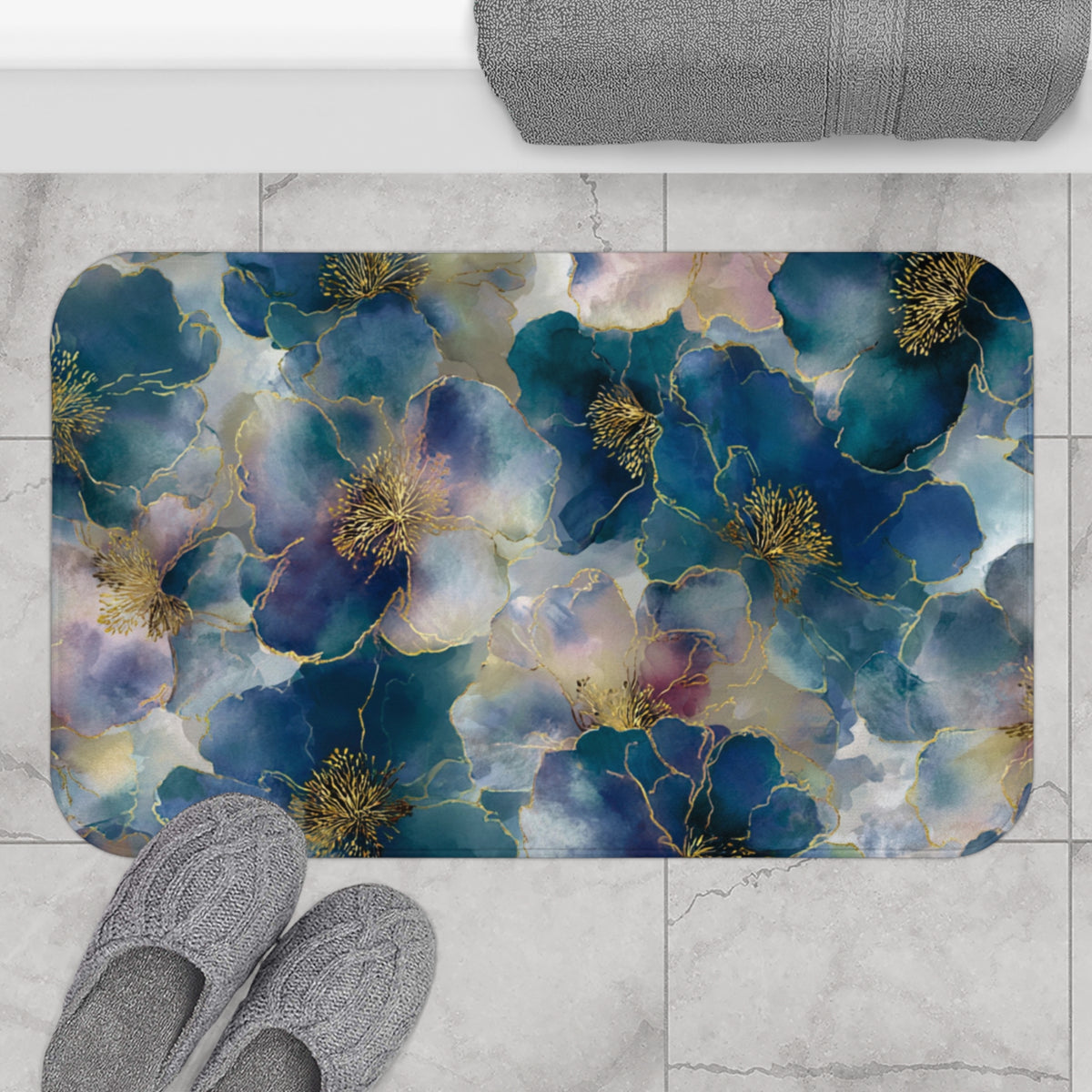 a bathroom mat with a floral design, placed on a tiled floor. There are two pairs of shoes visible in the image, one on the left side and the other on the right side.