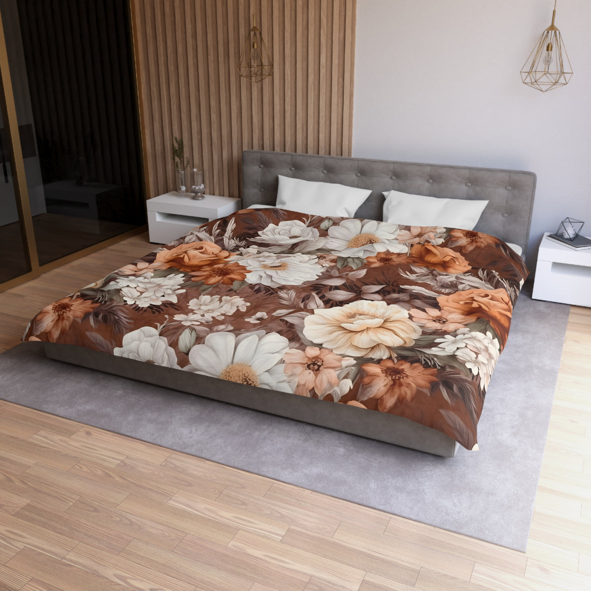 a bedroom with a large bed covered in a floral print comforter. The bed is positioned against a wall with a wooden paneling. There are two nightstands on either side of the bed, and a pendant light hangs above the bed. The room has a modern and stylish design, with a neutral color palette and a focus on natural elements like wood and flowers.