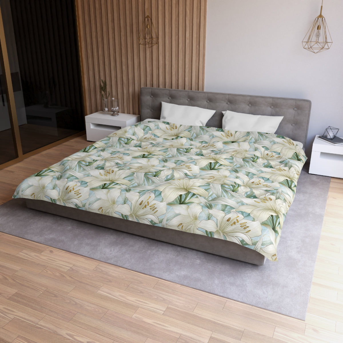 a modern bedroom with a large bed covered in a floral print comforter. The bed is positioned against a wall with a wooden panel. The room has a minimalist design, with a gray headboard and white nightstands. There is a pendant light hanging above the bed, and a vase on one of the nightstands. The overall atmosphere of the room is serene and elegant.