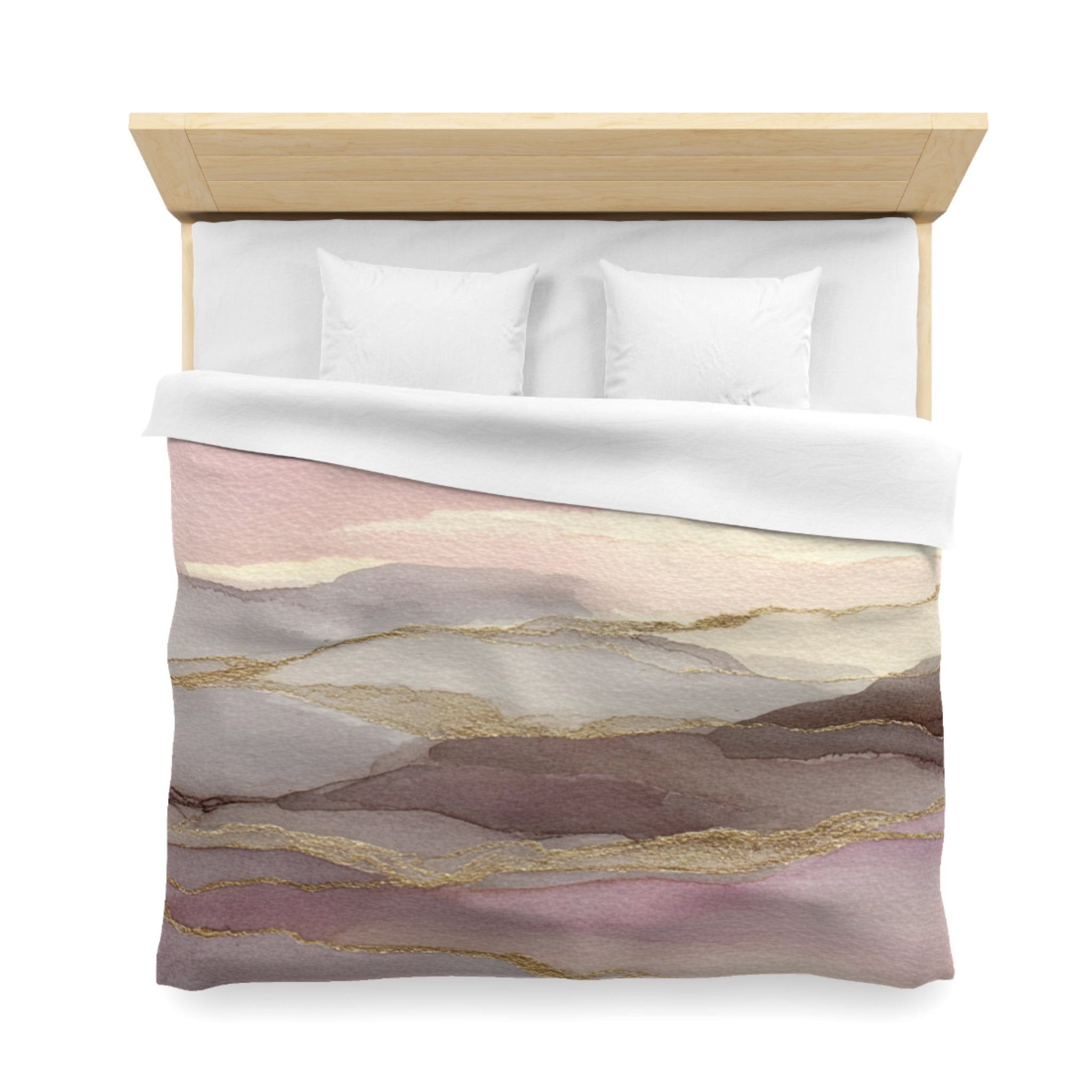 a bed with a white comforter and pillows, featuring a colorful abstract pattern in shades of pink, purple, and gold.