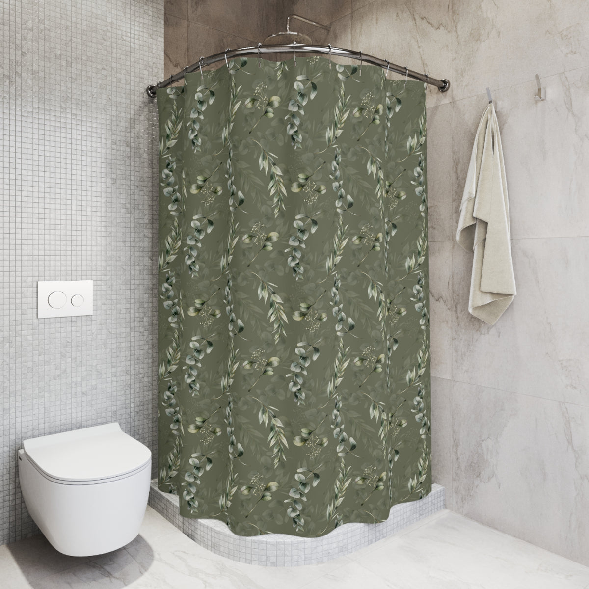 a bathroom with a shower curtain featuring a green leaf pattern, a white toilet, and a towel rack.