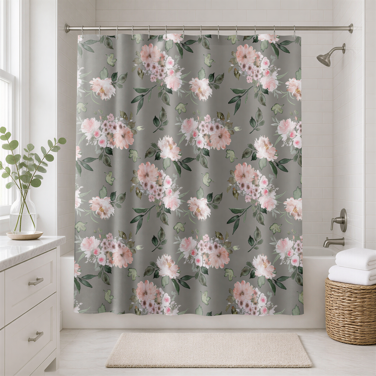 a bathroom with a shower curtain adorned with a floral pattern in shades of pink and green. The shower curtain is hanging from a rod, and there is a wicker basket placed next to it. The bathroom also includes a white countertop, a plant, and a rug on the floor.