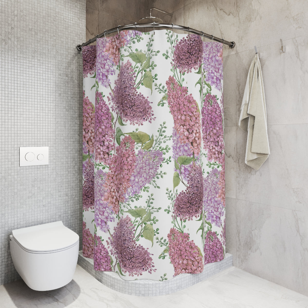a bathroom with a shower curtain adorned with a floral pattern of purple and green flowers. The shower curtain is hanging on a rod next to a towel. The bathroom has a white toilet and a white tiled wall.