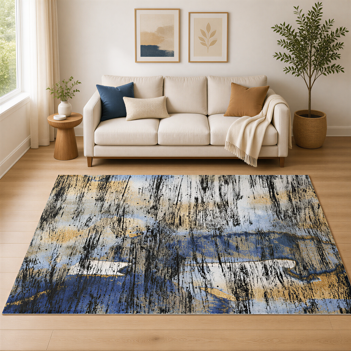 a living room with a white sofa, a large abstract rug, and two framed artworks on the wall.