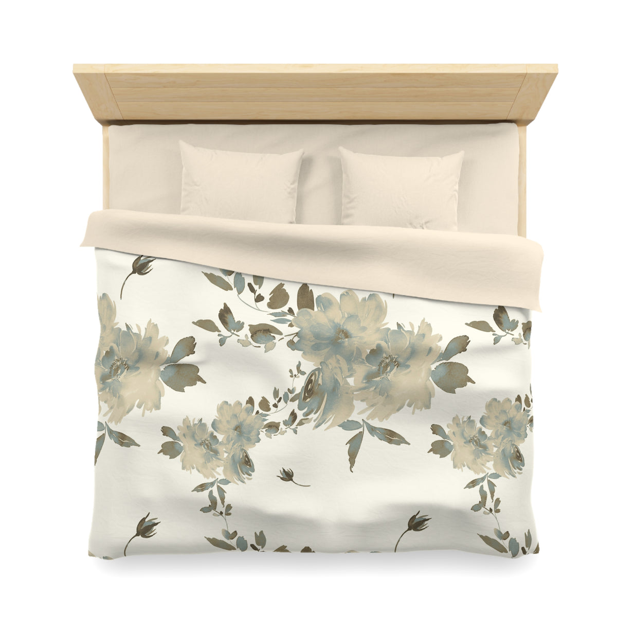 a neatly made bed with a floral print comforter and pillows.