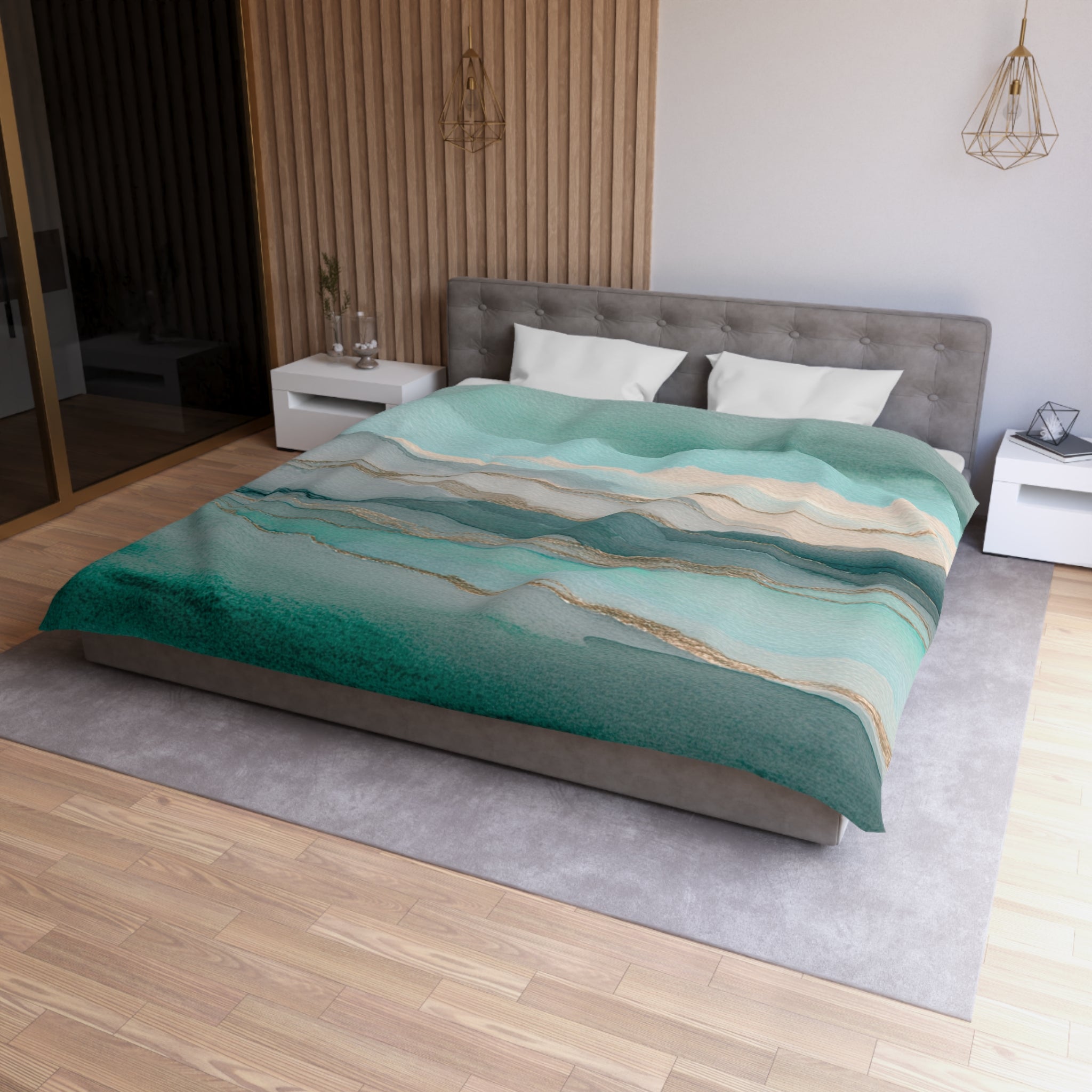 a modern bedroom with a large bed, a gray headboard, and a green and white patterned comforter. The room has a wooden floor and white walls, creating a serene and stylish atmosphere.