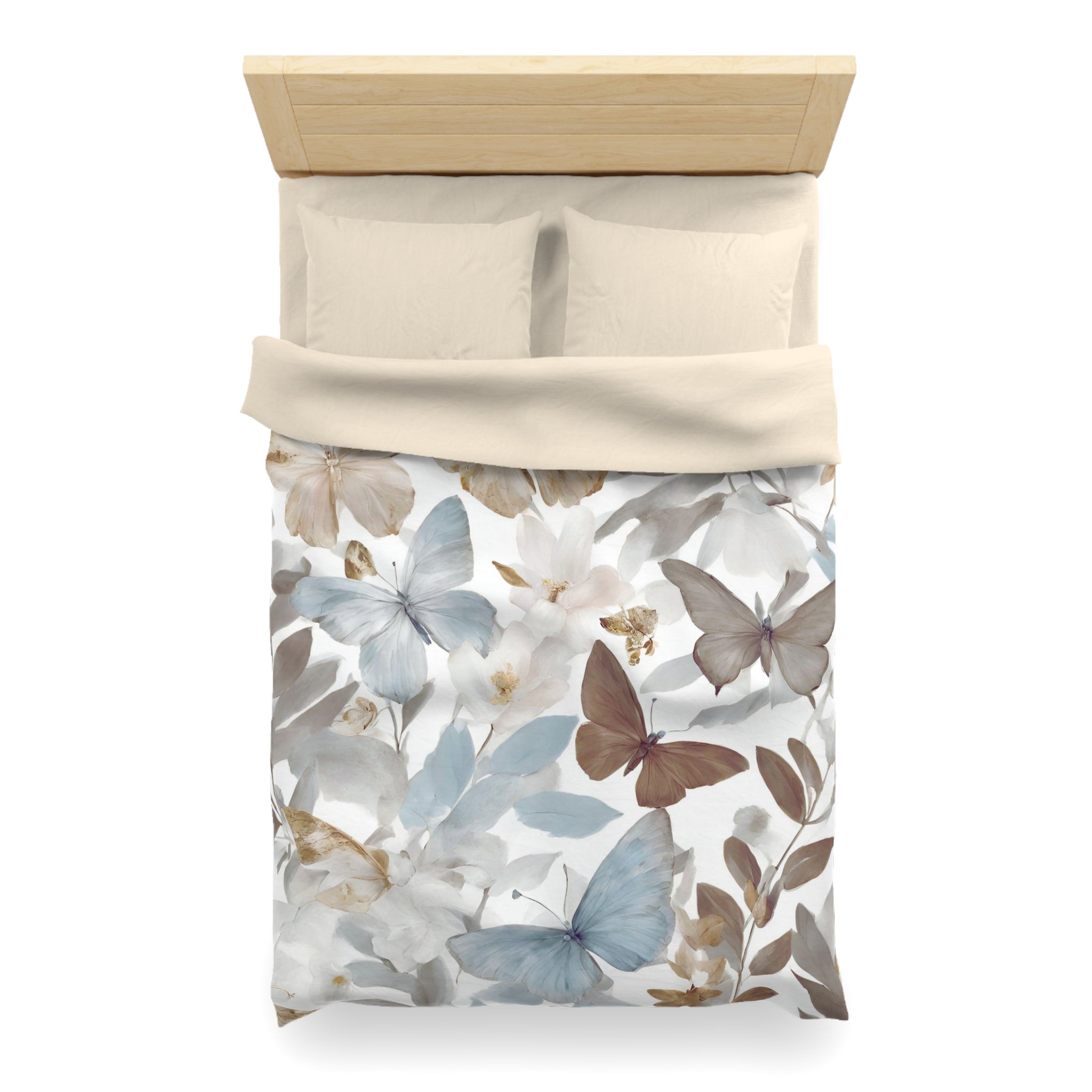 a bed with a floral print duvet cover featuring a design of butterflies and flowers in various shades of blue, white, and brown.