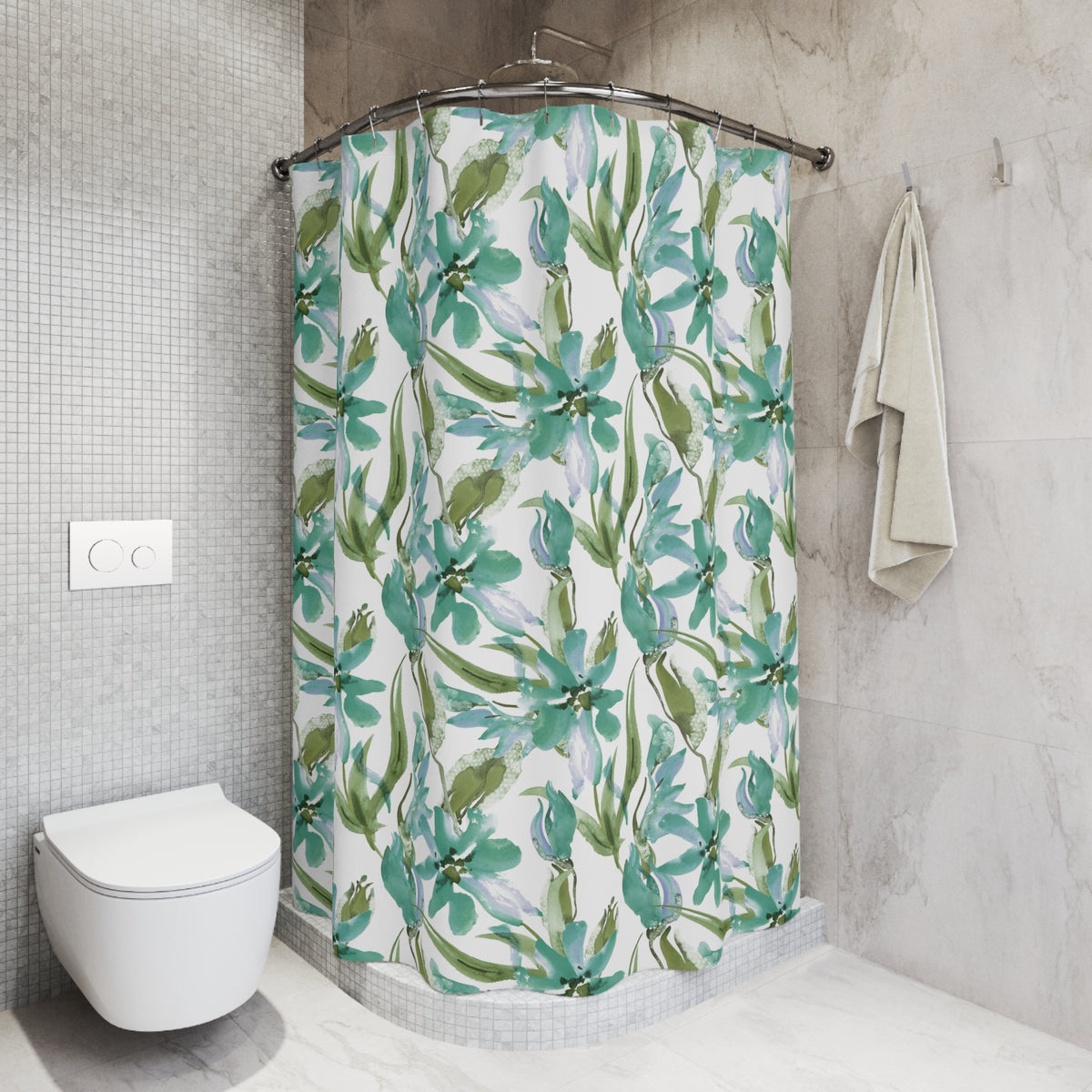 a bathroom with a shower curtain featuring a floral pattern in shades of green and white. The shower area is located next to a toilet, and there is a towel hanging on a hook nearby. The overall design and color scheme of the bathroom create a calming and natural atmosphere.