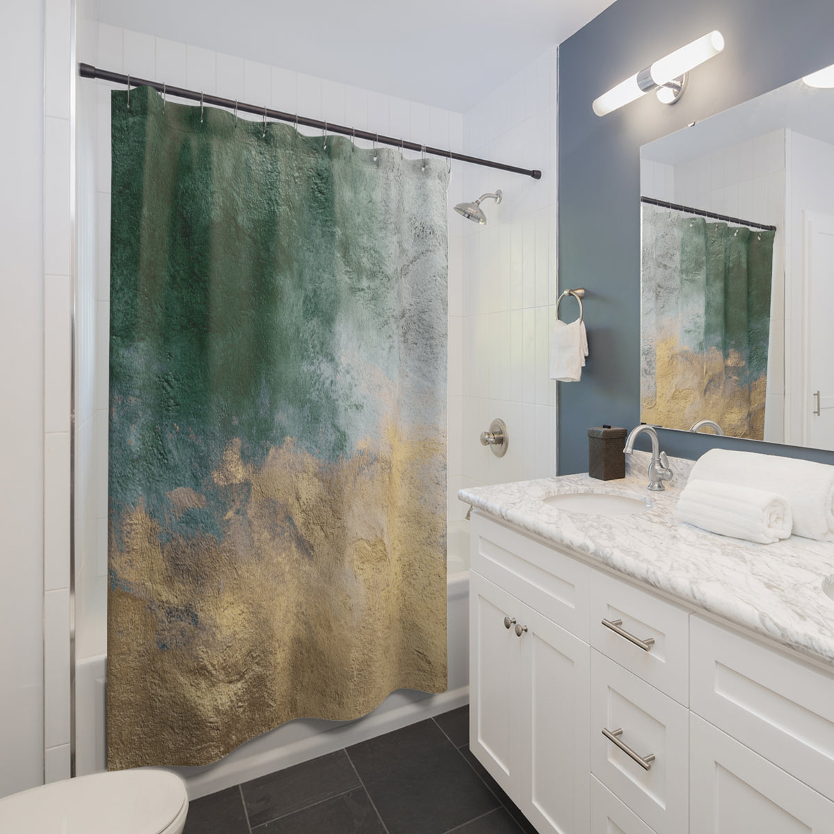 a modern bathroom with a white vanity, a shower curtain featuring a green and gold abstract design, and a mirror above the vanity.