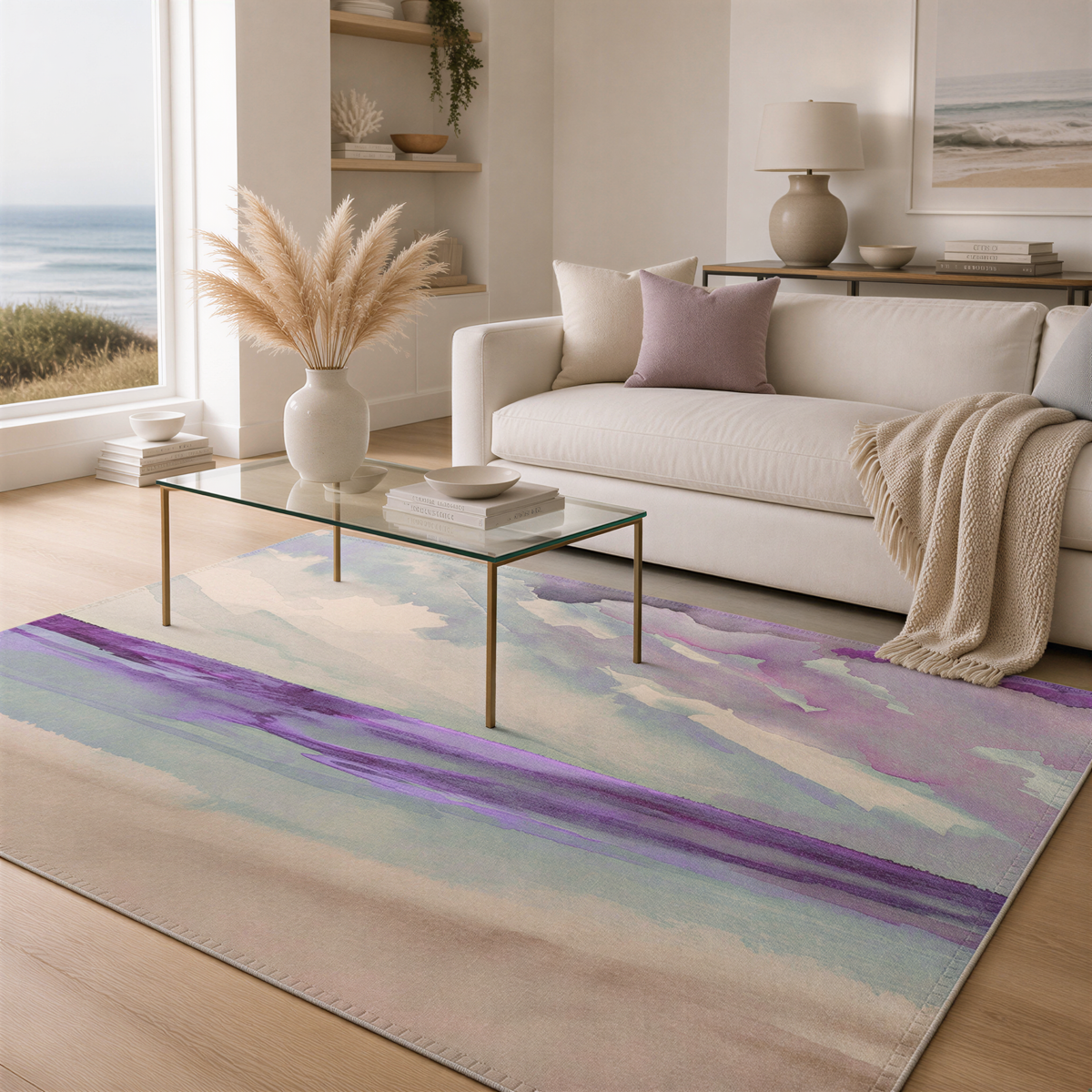 a cozy living room with a large window overlooking the ocean, a white sofa, a glass coffee table, and a colorful abstract rug on the floor.