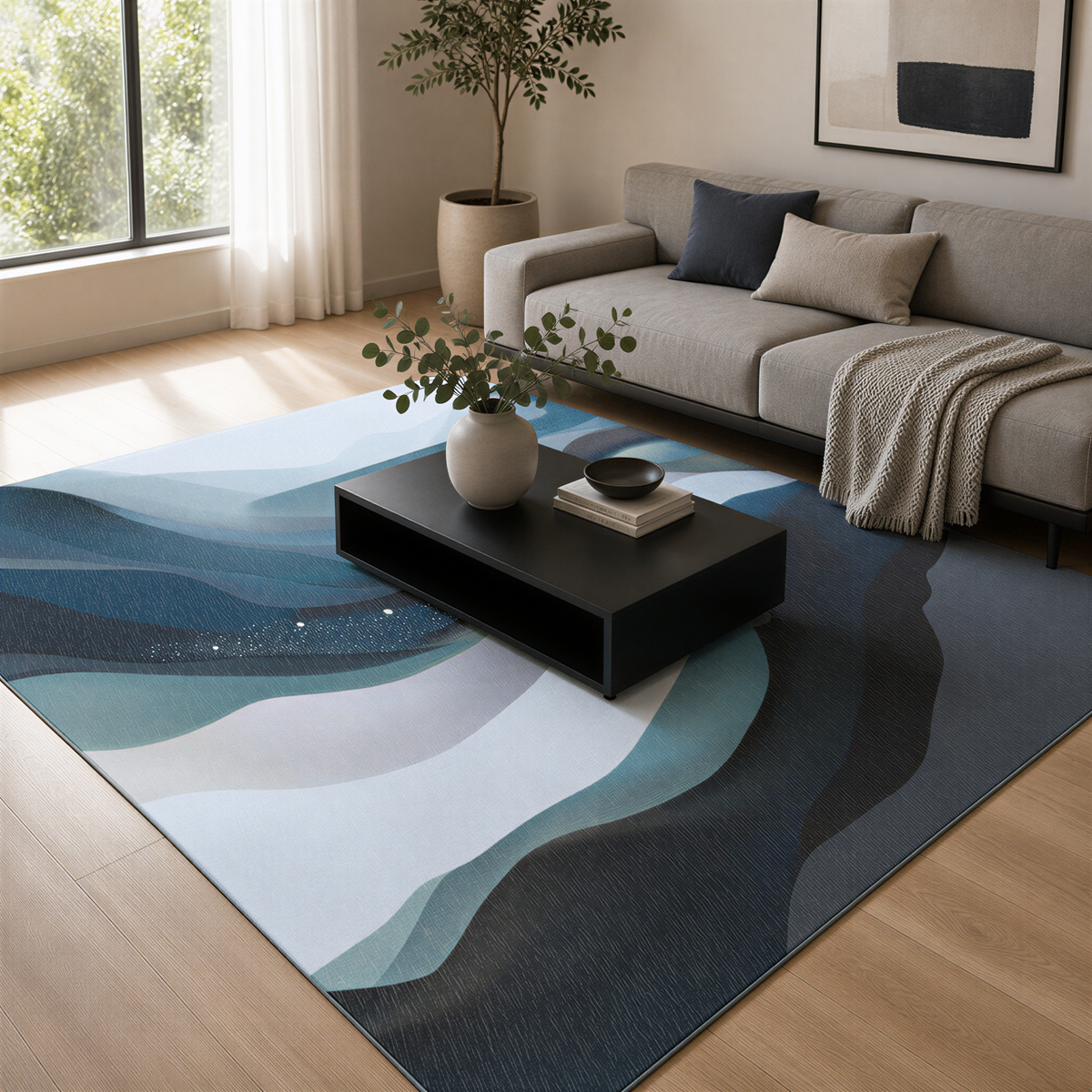 a modern living room with a gray sofa, a black coffee table, and a large abstract rug with blue and white waves. The room is decorated with a potted plant, a vase, and a stack of books on the coffee table.