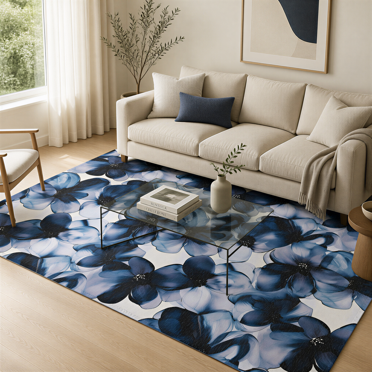 a living room with a large white sofa, a glass coffee table, and a blue and white floral area rug. The room has a minimalist and modern design, with a large window providing natural light and a view of the outdoors.