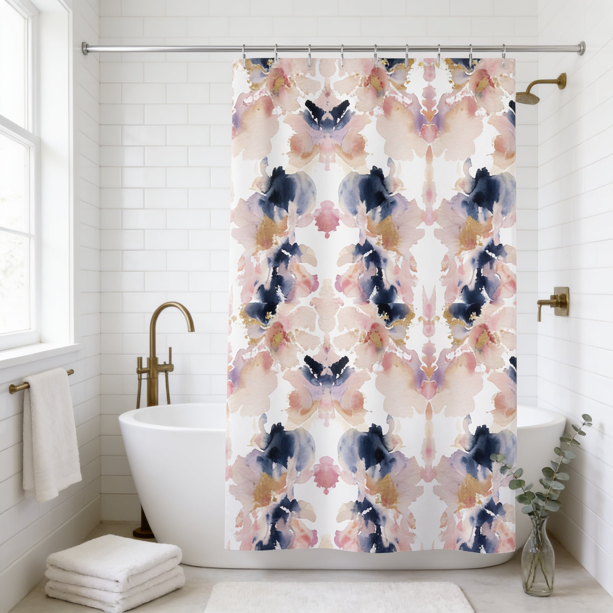 a bathroom with a white bathtub, a shower curtain with a floral pattern, and a gold faucet. There is also a small plant and a towel rack in the room.
