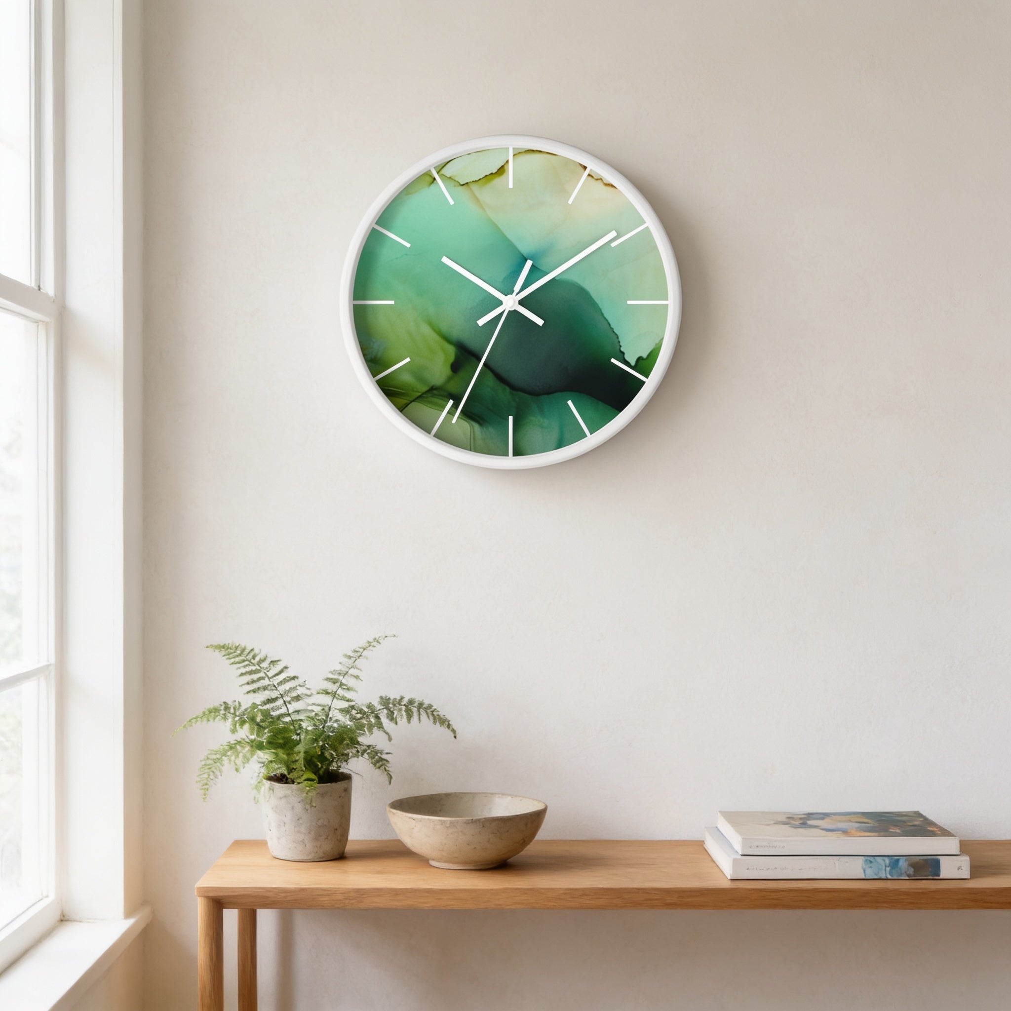 a wall clock with a green and white abstract design, a potted plant, a wooden table with a bowl and a book, and a window in the background.